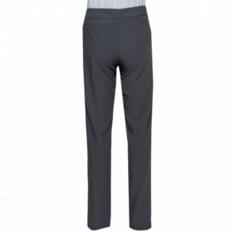 Smart trousers are wardrobe essentials and offering a whole lot of effortless style are these ones from Armani Collezioni! The grey trousers are made of 100% wool and feature a simple design. They are equipped with a zip closure and will look great