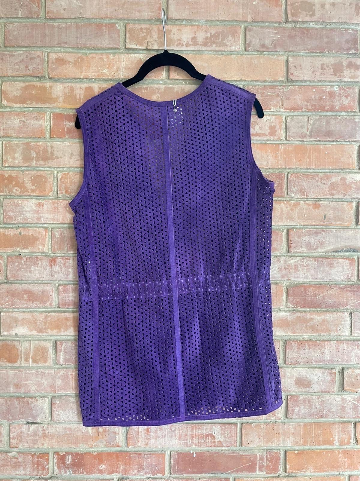 Armani Collezioni purple suede waistcoat, fully perforated, with button closure on the front. 
Size indicated: 42 Italian.
Shows some signs of use but in good condition. 
Shoulders 40 cm
Bust 48 cm
44cm waist with drawstring 
72cm long
