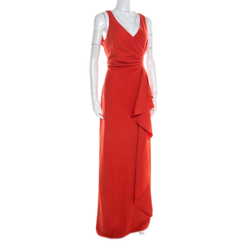 Cozy and classic for all seasons, this dress is a wardrobe staple. Sport this impressive Armani Collezioni dress and create a stunning statement at those soirees. It has a plunging neckline and is adorned with ruffle detail to the front. Suited for