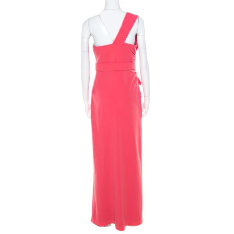 Gorgeously designed to make you look divine, this one shoulder evening gown from Armani Collezioni is love at first sight! The salamander pink crepe creation features a flattering feminine silhouette. It flaunts subtle pleats and an artistic bow