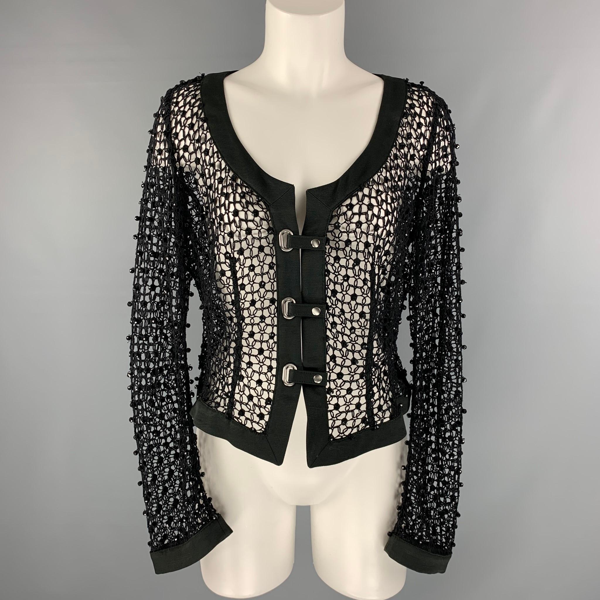 ARMANI COLLEZIONI jacket comes in black mesh fabric, scoop neck, cross over snap button closure and black beaded sequins. Made in Italy.

Excellent Pre-Owned Condition. Fabric Tag Removed.
Marked: 10

Measurements:

Shoulder: 15 in.
Bust: 40