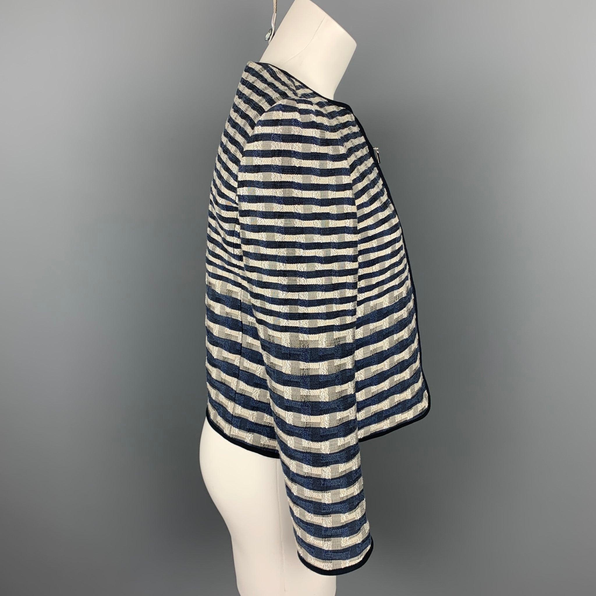 ARMANI COLLEZIONI jacket comes in a navy & white jacquard featuring no collar and a full zip up closure.
Very Good
Pre-Owned Condition. 

Marked:   2 

Measurements: 
 
Shoulder: 15 inches  Bust: 34 inches  Sleeve: 23 inches  Length: 19.5 inches 
 