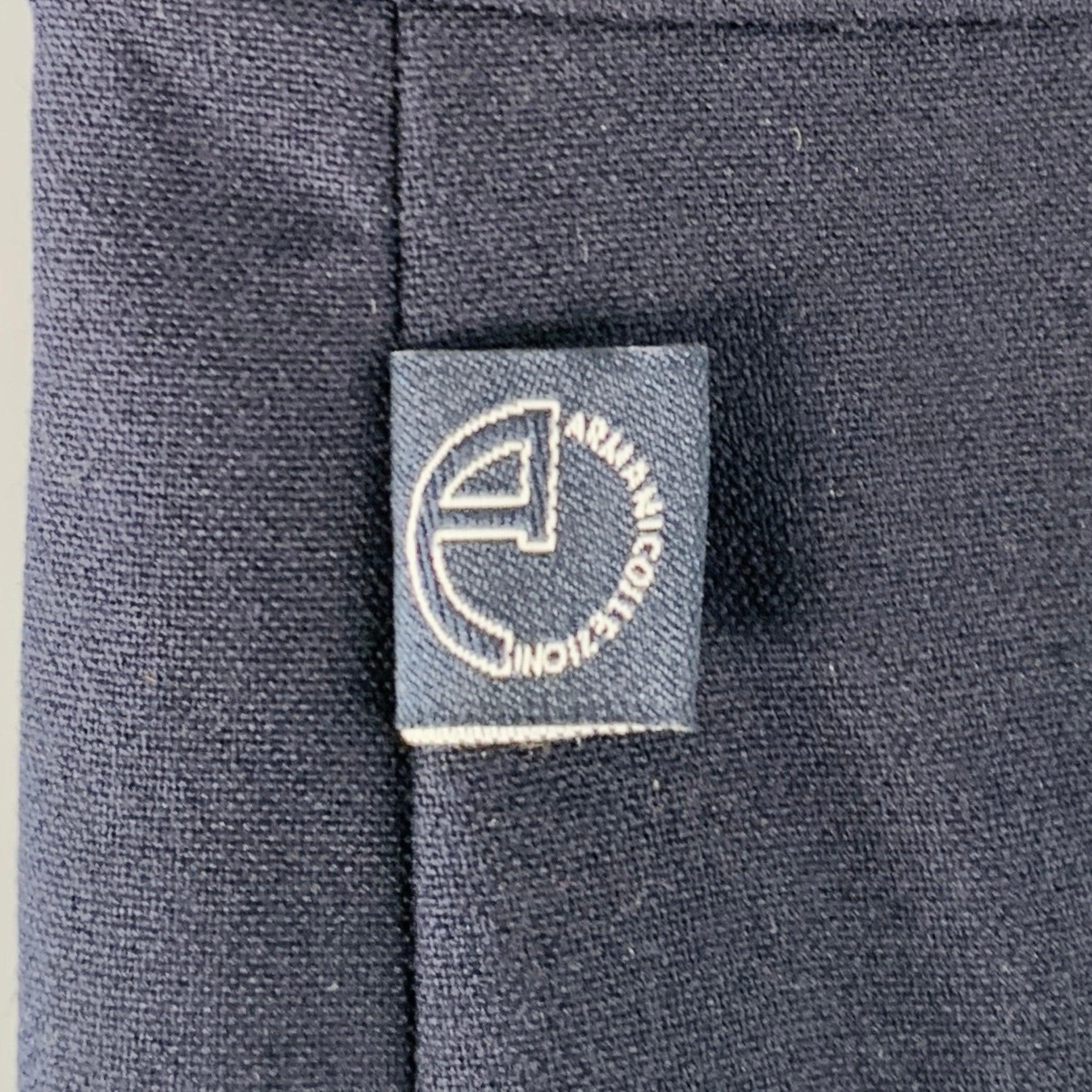 ARMANI COLLEZIONI dress pants
in a navy polyester blend fabric featuring a flat front style, straight leg, and zip fly closure. Made in Moldova. New with Tags. 

Marked:   IT 46 

Measurements: 
  Waist: 30 inches Rise: 9.5 inches Inseam: 36 inches