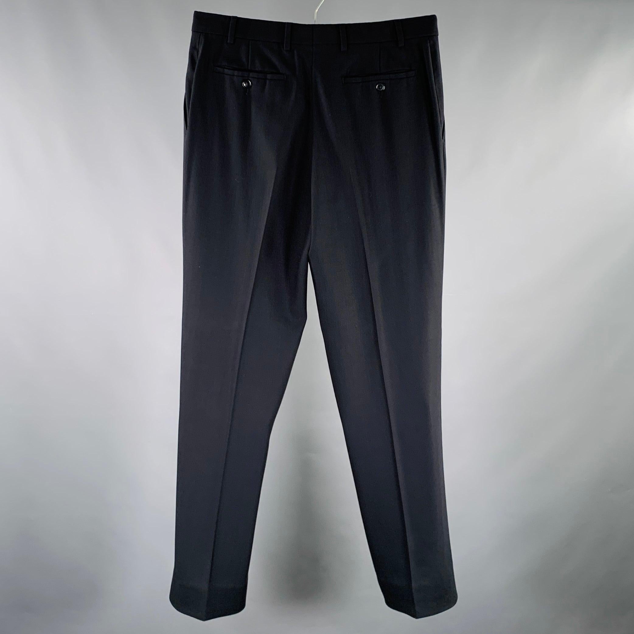 ARMANI COLLEZIONI dress pants
in a black fabric featuring a flat front style, straight leg, and zip fly closure.Excellent Pre-Owned Condition. 

Marked:   IT 48 

Measurements: 
  Waist: 32 inches Rise: 10 inches Inseam: 29 inches  Leg Opening: 17