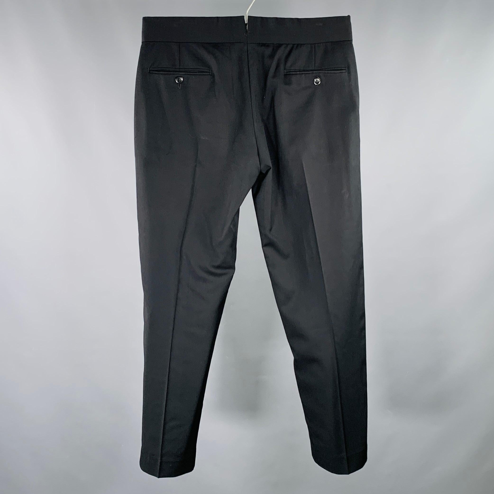 ARMANI COLLEZIONI dress pants
in a black woven fabric featuring a flat front style, straight leg, and zip fly closure. Excellent Pre-Owned Condition. 

Marked:   40 

Measurements: 
  Waist: 30 inches Rise: 9.5 inches Inseam: 28 inches  
  
  
 
Sui