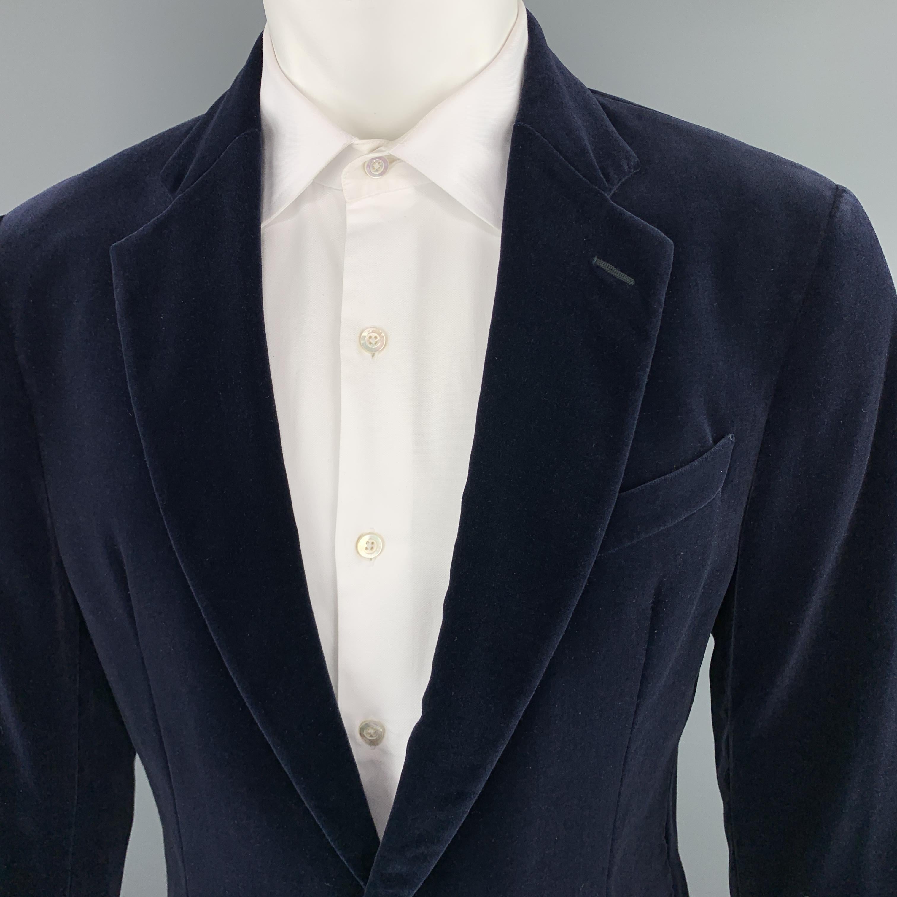 ARMANI COLLEZIONI sport coat comes in navy blue velvet with a notch lapel, single breasted, two button front, and ventless back.

Excellent Pre-Owned Condition.
Marked: 40

Measurements:

Shoulder: 18 in.
Chest: 44 in.
Sleeve: 22.5 in.
Length: 32 in.