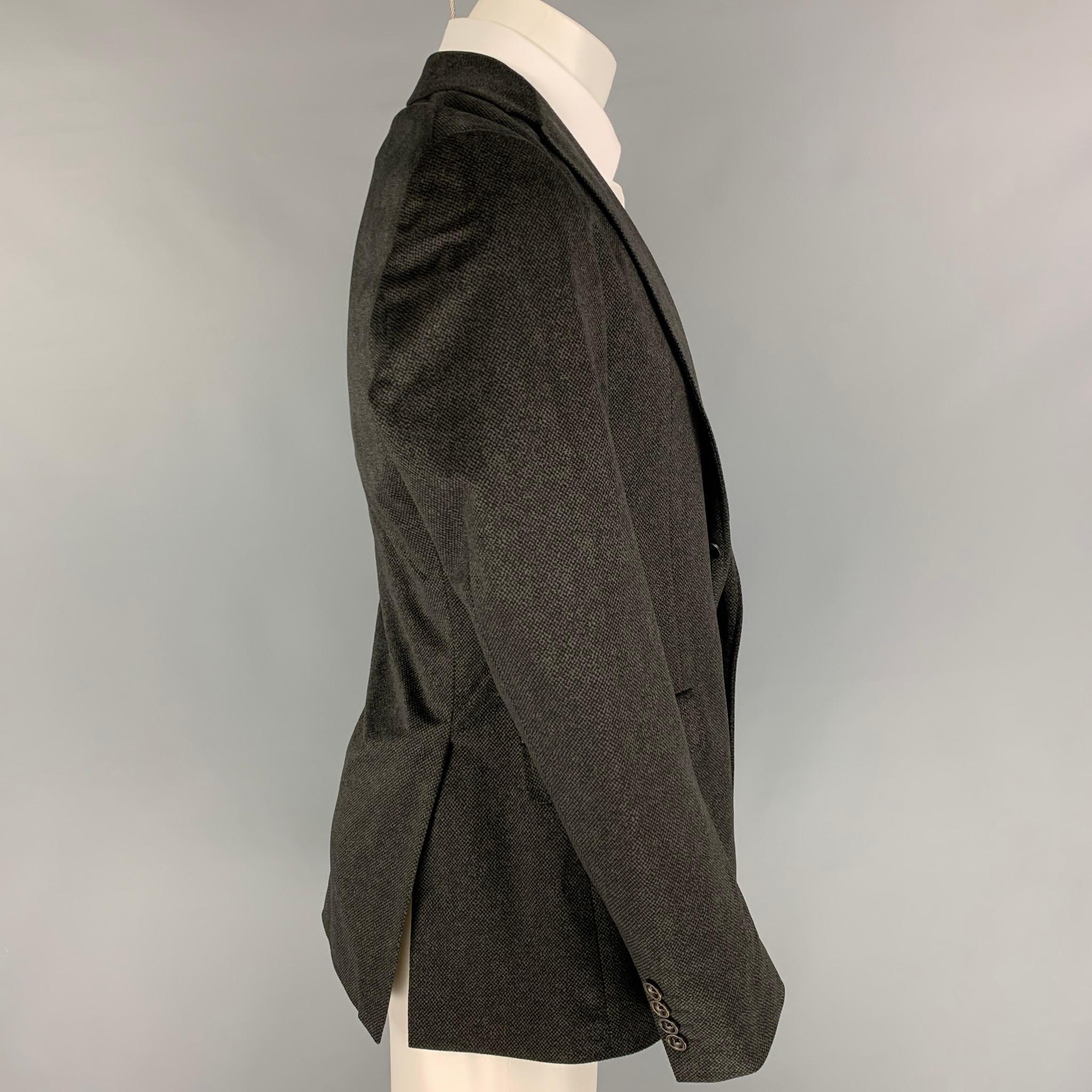 ARMANI COLLEZIONI sport coat comes in a charcoal / black polyester with a full liner featuring a notch lapel, flap pockets, double back vent, and a double button closure. 

Very Good Pre-Owned Condition.
Marked: 40

Measurements:

Shoulder: 17.5