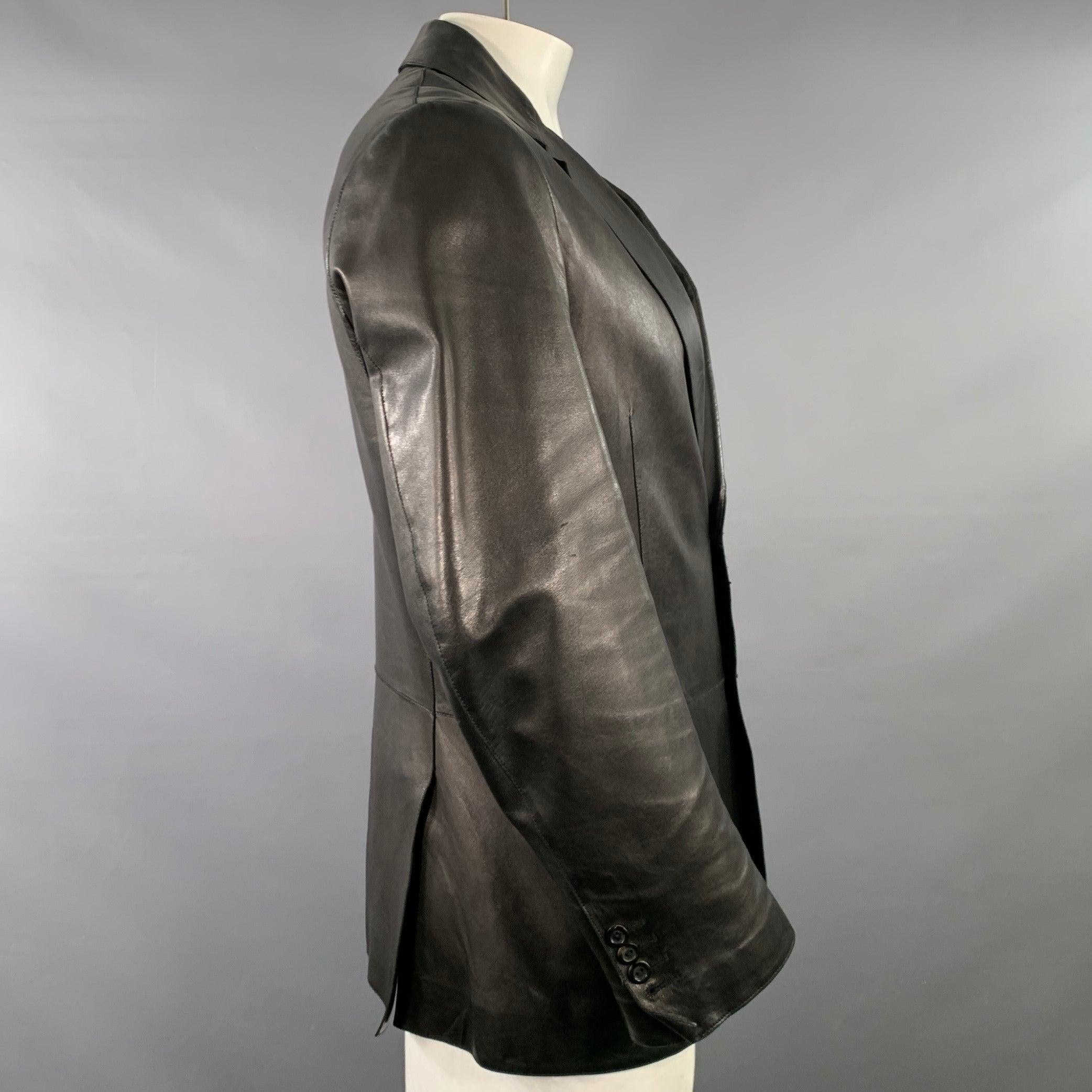 ARMANI COLLEZIONI jacket
in a soft black lambskin leather featuring a notch lapel, double vented back, and double button closure. Made in Poland.Very Good Pre-Owned Condition. Minor marks on sleeve. 

Marked:   42 

Measurements: 
 
Shoulder: 19.5