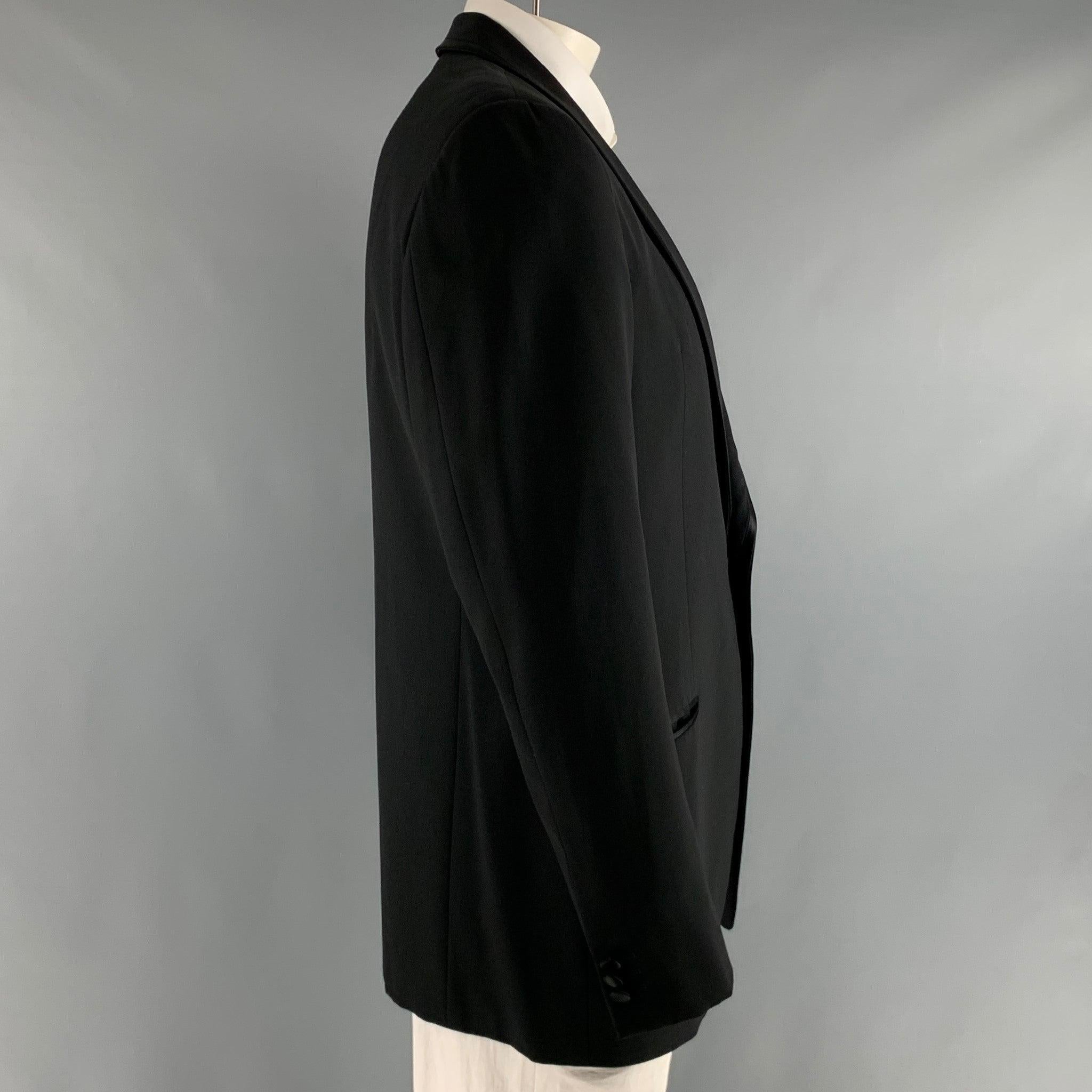 ARMANI COLLEZIONI sport coat comes in black wool woven material, with a full liner featuring a shawl collar, welt pockets, single button closure, single breasted. Made in Italy.Excellent Pre-Owned Condition. 

Marked:   42 R 

Measurements: 
