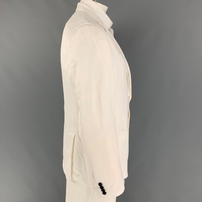 ARMANI COLLEZIONI sport coat comes in a white viscose / linen with a half liner featuring a notch lapel, flap pockets, double back vent, and a double button closure. 

Good Pre-Owned Condition. Minor wear. As-Is.
Marked: 56

Measurements:

Shoulder: