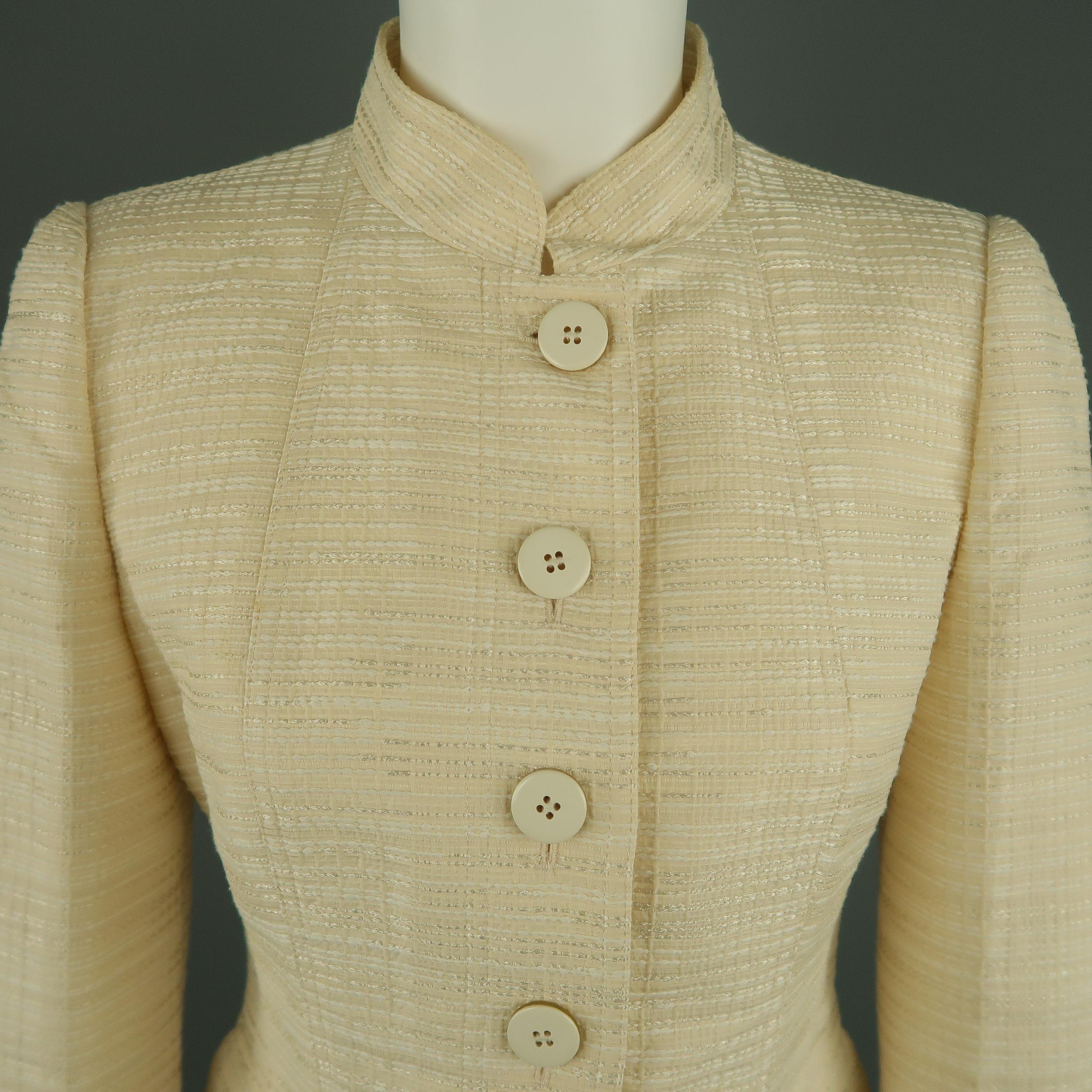 ARMANI COLLEZIONI jacket comes in cream stitch textured fabric with a Mandarin collar, singe breasted button up front, and flap pockets. Made in Italy.
 
Excellent Pre-Owned Condition.
Marked: 6
 
Measurements:
 
Shoulder: 14 in.
Bust: 36