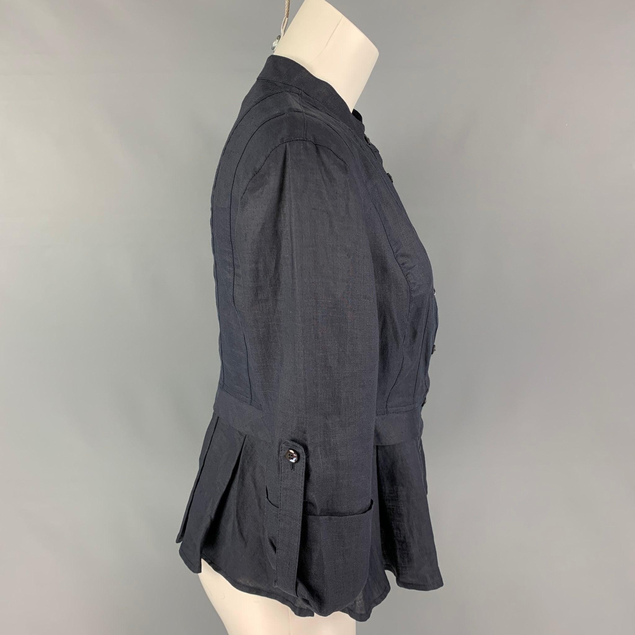 ARMANI COLLEZIONI top comes in a navy viscose featuring a pleated style, collarless, 3/4 sleeves, and a buttoned closure.
Very Good
Pre-Owned Condition. 

Marked:   6 

Measurements: 
 
Shoulder: 16.5 inches  Bust: 34 inches  Sleeve: 15.5 inches 