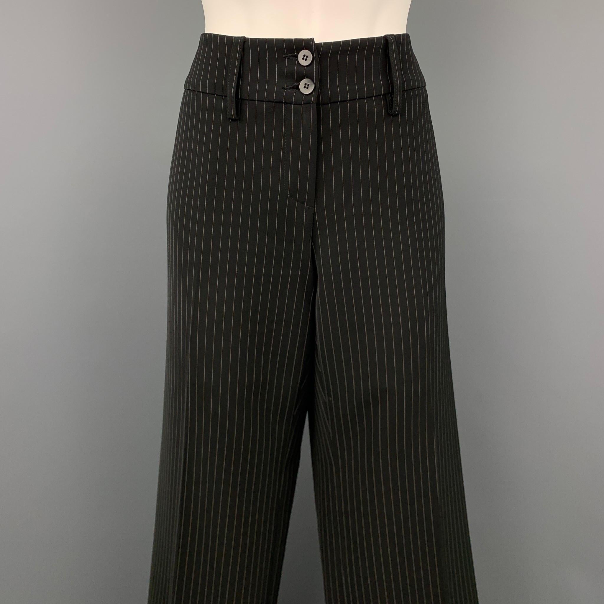 ARMANI COLLEZIONI dress pants comes in a black pinstripe polyester blend featuring a wide leg, double button, and a zip fly closure. Made in Italy.

Very Good Pre-Owned Condition.
Marked: 8

Measurements:

Waist: 32 in.
Rise: 7.5 in.
Inseam: 36 in. 