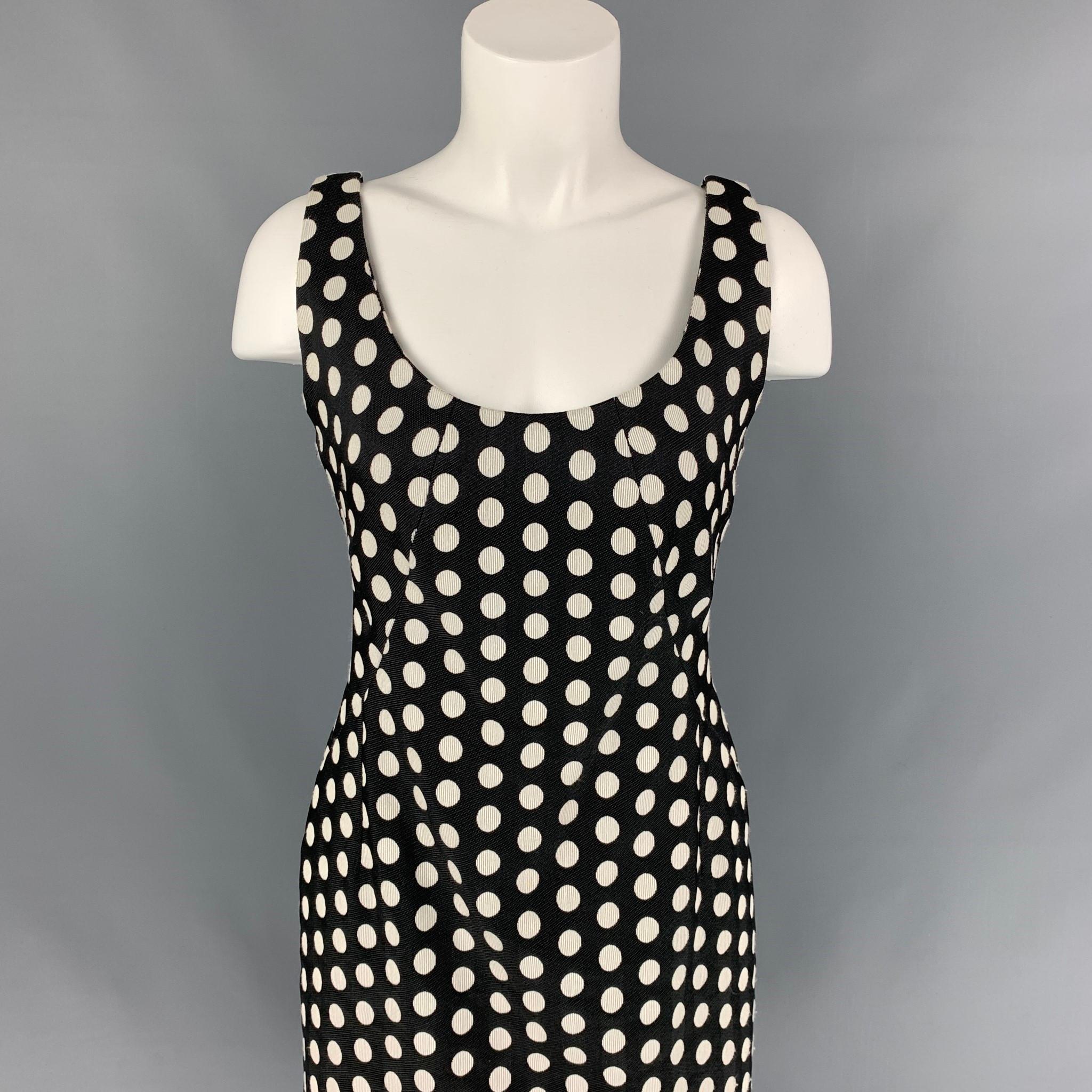 ARMANI COLLEZIONI dress comes in a black & white polka dot material featuring a sheath style, scoop neck, and a back zipper closure. 

Very Good Pre-Owned Condition.
Marked: 8

Measurements:

Bust: 32 in.
Waist: 31 in.
Hip: 34 in.
Length: 29 in. 