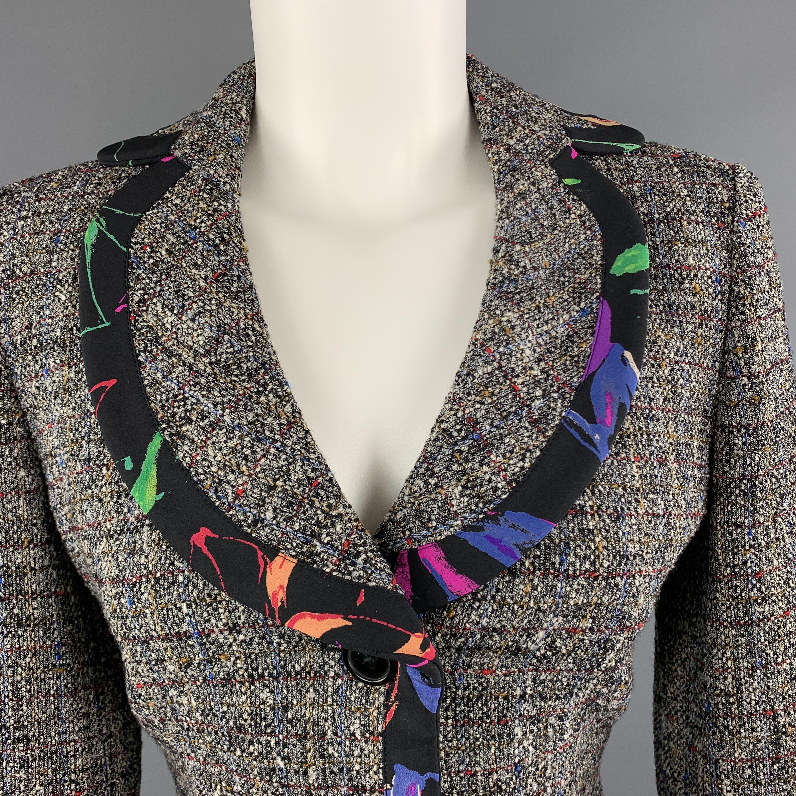 ARMANI COLLEZIONI blazer comes in black and white tweed with multi-color pattern throughout and features a single breasted three button front, round lapel, and floral print trim. Made in Italy.

Excellent Pre-Owned Condition.
Marked: