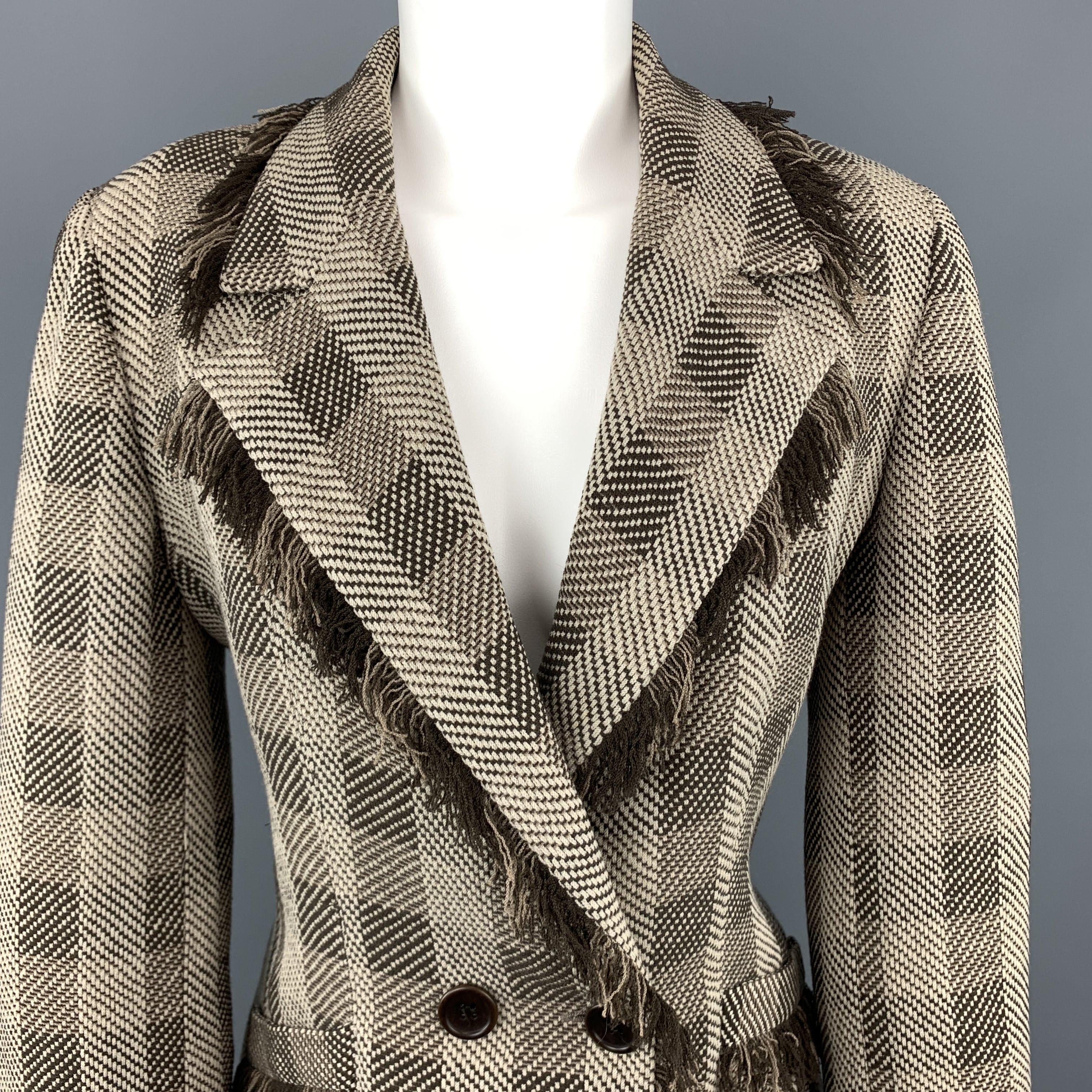 ARMANI COLLEZIONI blazer comes in taupe and brown plaid virgin wool blend fabric with a notch lapel, slanted pockets, and fringe trim throughout. Made in Italy.
 
Excellent Pre-Owned Condition.
Marked: 8
 
Measurements:
 
Shoulder: 15 in.
Bust: 40