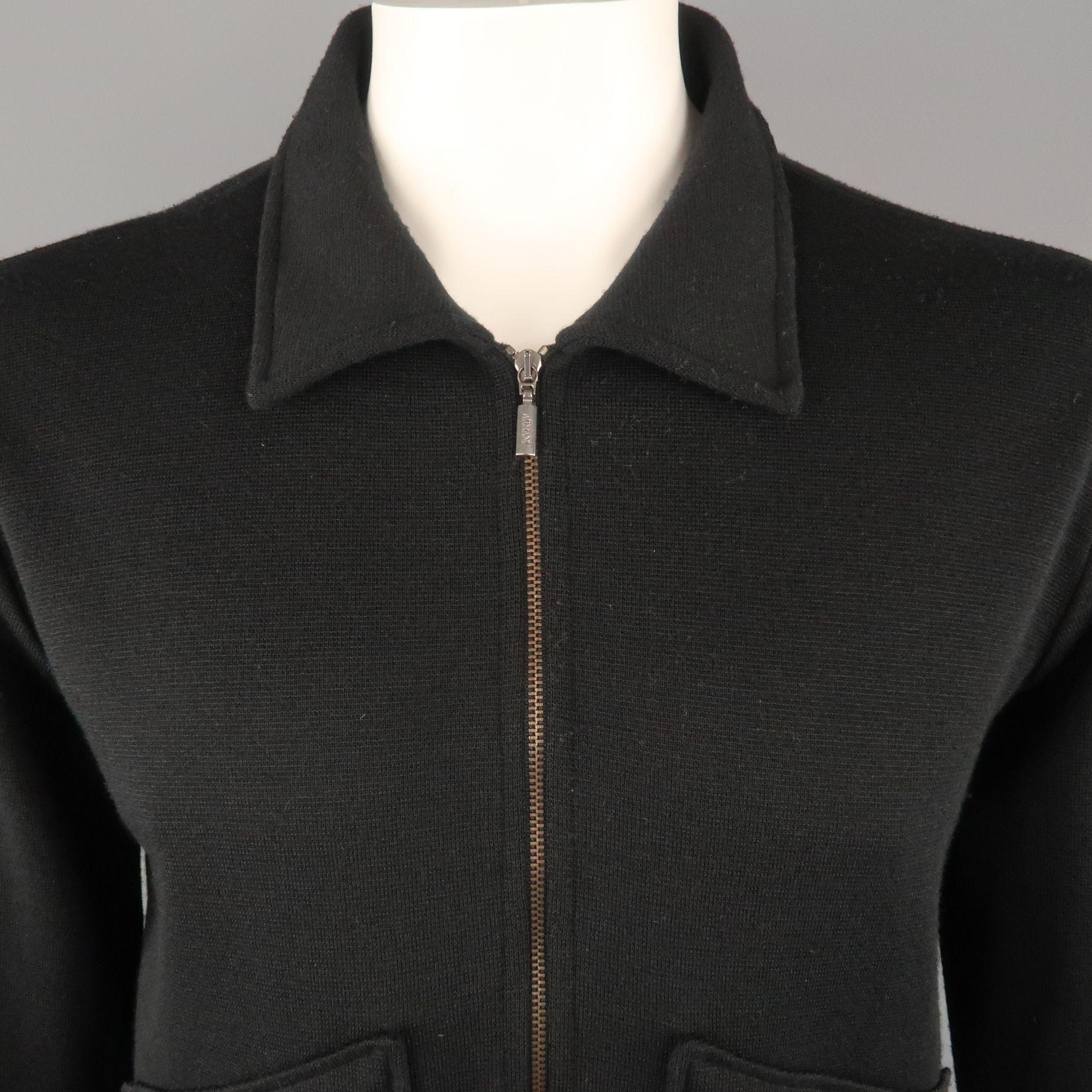 ARMANI COLLEZIONI jacket comes in a black wool blend featuring a spread collar, front zipper patch pockets, stripe trim, and a full zip closure. Made in Italy.

Excellent Pre-Owned Condition.
Marked: L

Measurements:

Shoulder: 21 in.
Chest: 44