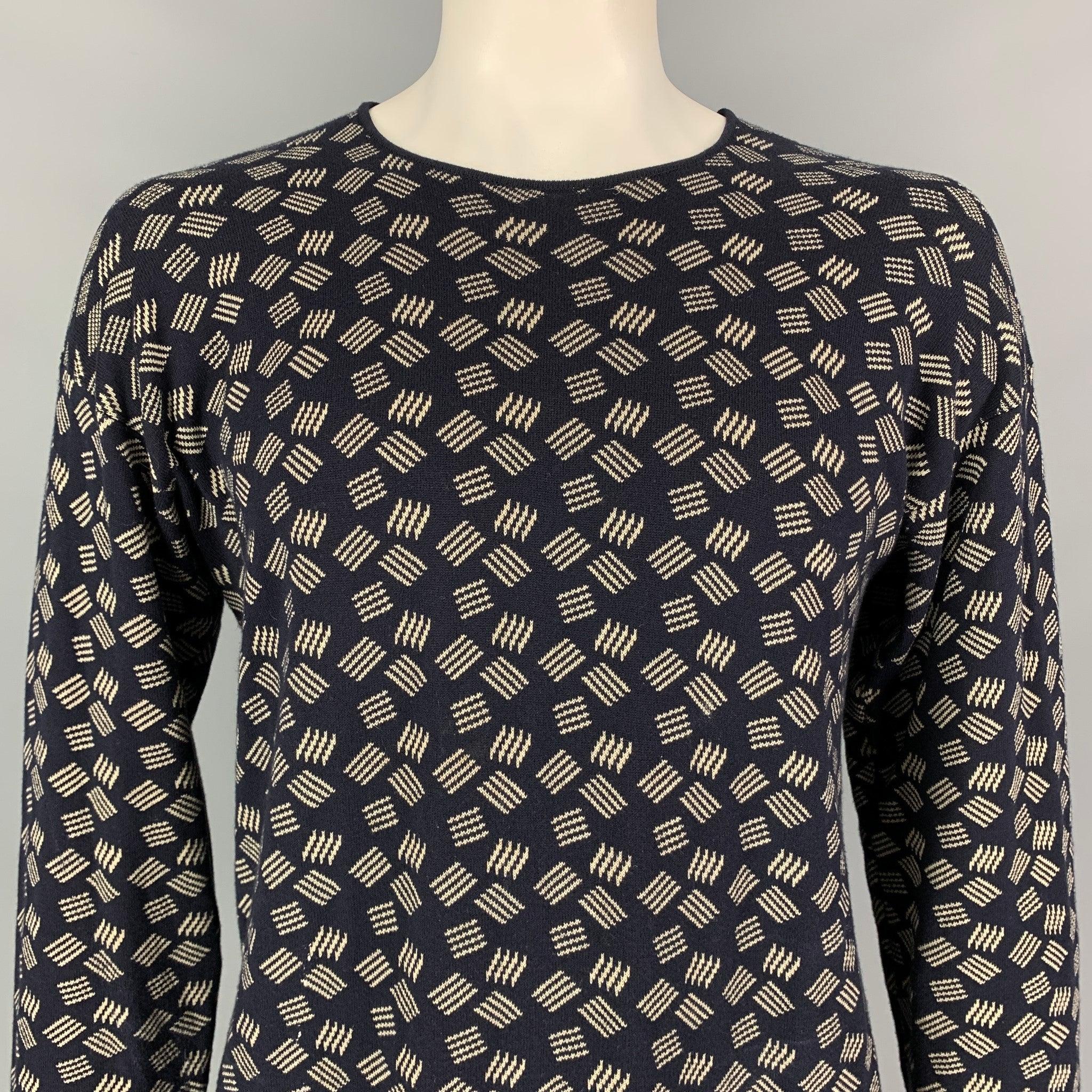 ARMANI COLLEZIONI pullover comes in a navy & ivory knitted cotton / rayon featuring a crew-neck. Made in Italy.Very Good Pre-Owned Condition. 

Marked:   L 

Measurements: 
 
Shoulder: 25 inches Chest: 46 inches Sleeve: 24 inches Length: 27.5 inches