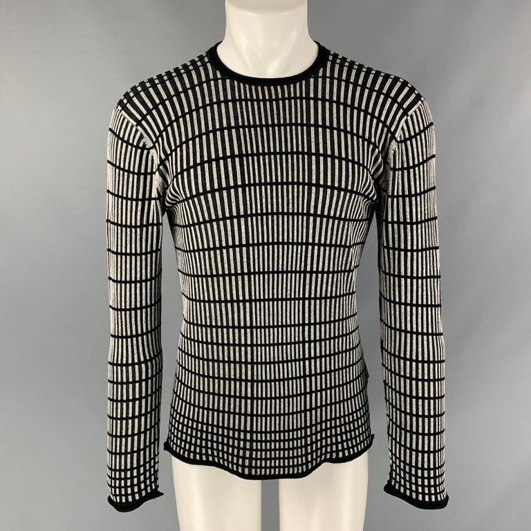 ARMANI COLLEZIONI pullover comes in a black and grey knitted stripped silk featuring a raw-neck.

Excellent Pre-Owned Condition.
Marked: M

Measurements:

Shoulder: 23 in.
Chest: 48 in.
Sleeve: 26 in.
Length: 27 in. 