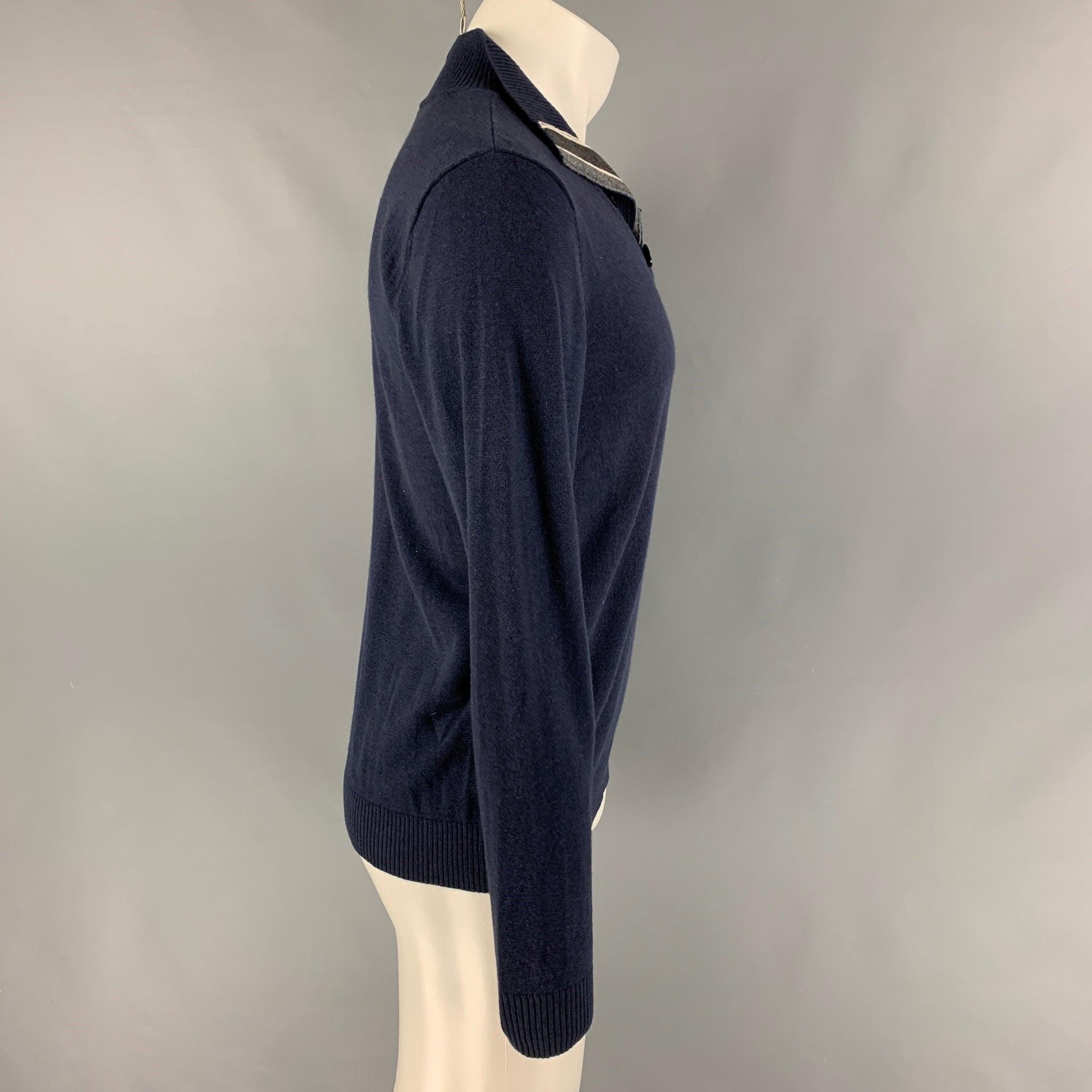 ARMANI COLLEZIONI pullover comes in a blue wool blend featuring a buttoned high collar.Very Good
Pre-Owned Condition. 

Marked:   Size tag removed. 

Measurements: 
 
Shoulder:17 inches  Chest: 38 inches  Sleeve: 27 inches  Length: 25.5 inches 
  
 
