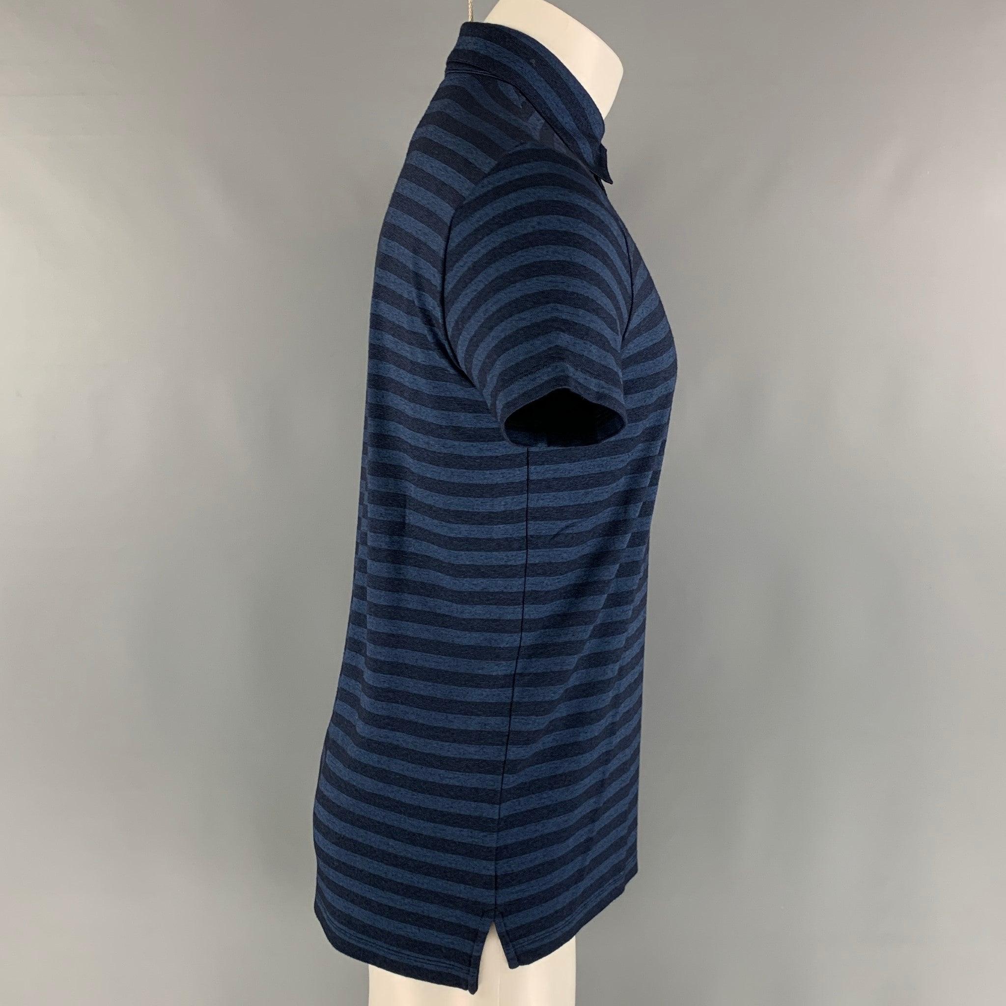 ARMANI COLLEZIONI polo comes in a navy and blue striped viscose blend knit featuring a spread collar, and a half buttoned closure. Excellent Pre-Owned Condition.  

Marked:   M 

Measurements: 
 
Shoulder: 18 inches Chest: 42 inches Sleeve: 8 inches