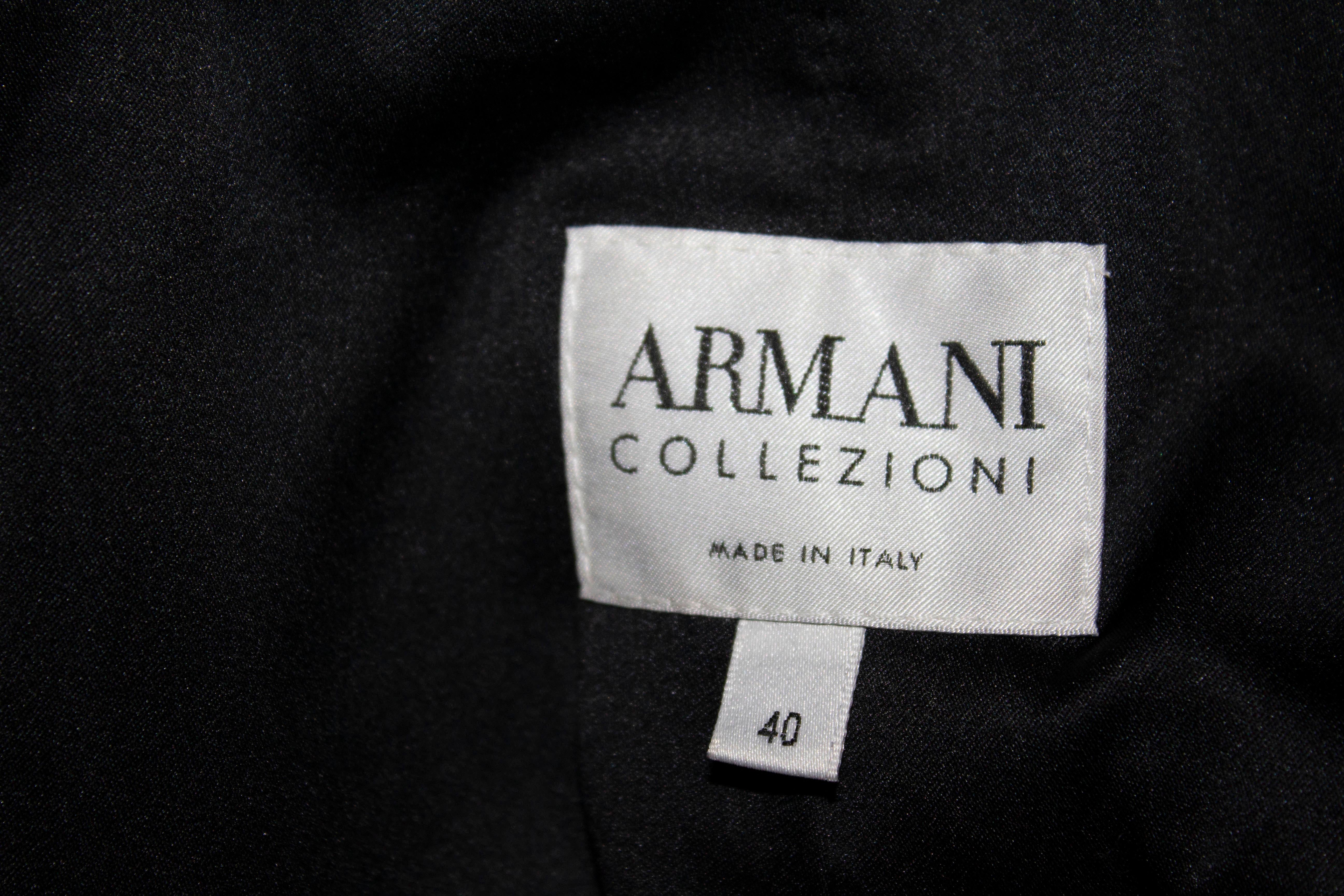A fabulous jacket by Armani Collezioni . In a quilt like fabric , the jacket is in a pretty shade of brown with elbow length sleaves , and has a deep v neckline with one button fastening. 
Labelled size 40, Bust 35'', length 22''