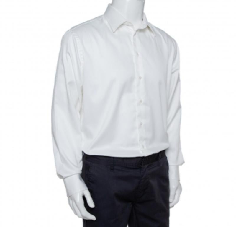 Perfect to add to your formal collection, this white-hued Armani Collezioni shirt comes tailored from cotton and styled with a collar, front buttons, and long sleeves. It is sure to bring you comfortable fashion.