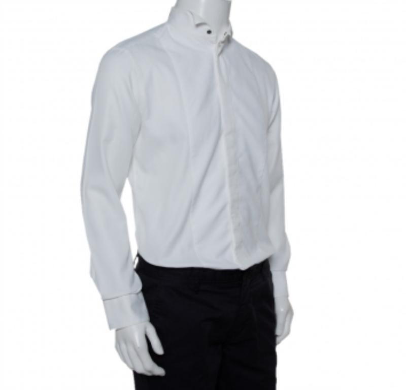 Sharp, neat, and crisp! Tailored wonderfully from cotton, this white shirt by Armani Collezioni will complement your tuxedos with class. It has been styled with a stand collar, front buttons, long sleeves, and offers a tailored fit.