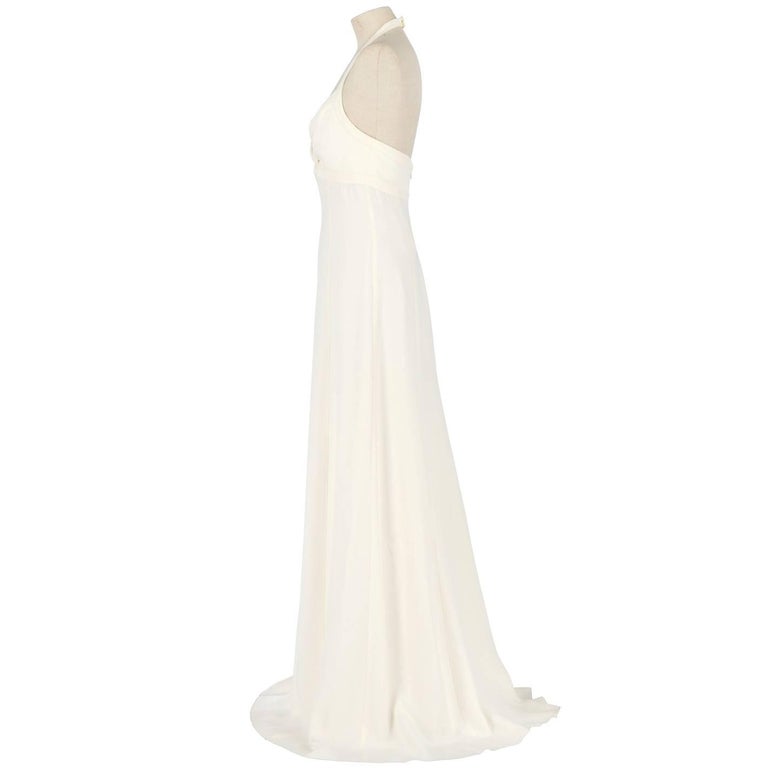 A.N.G.E.L.O. Vintage - Italy

Marvelous Armani silk and acetate wedding dress in ivory white color. It features a V neckline top, shoulder straps fastened behind the neck and is backless. Zip closure on the back. The item comes with its original