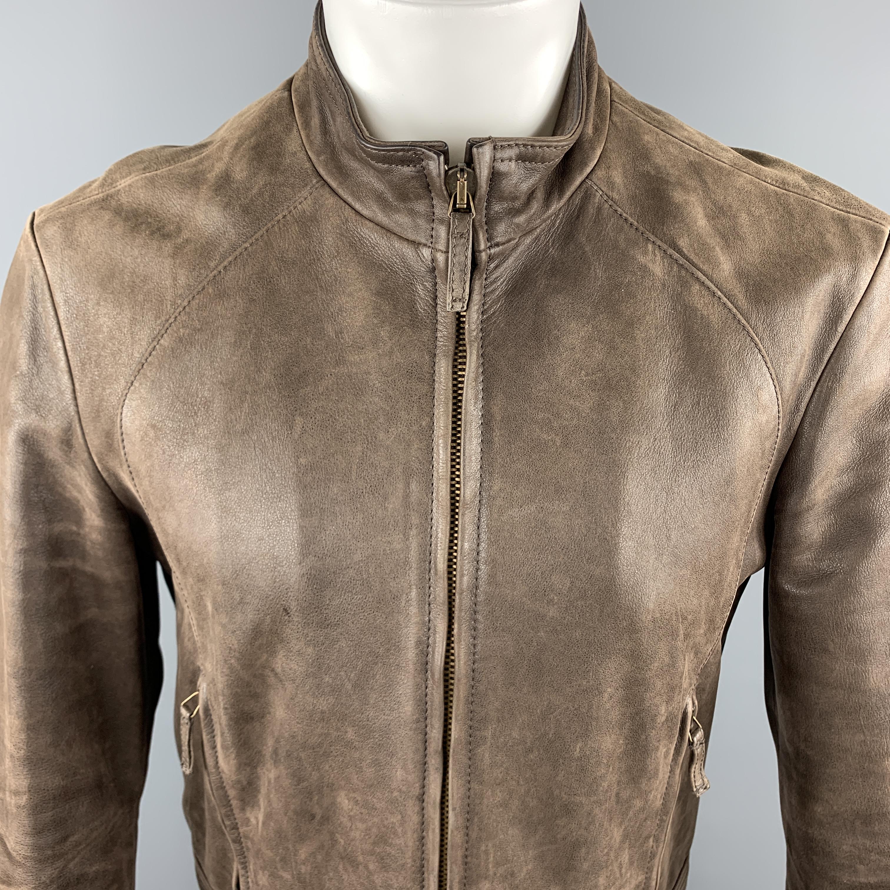 ARMANI JEANS jacket comes in a brown leather material, with a zip at closure, pockets and cuffs, a quilted lining, featuring a distressed effect. Made in Romania. 

Excellent Pre-Owned Condition.
Marked: US 34

Measurements:

Shoulder: 18 in.