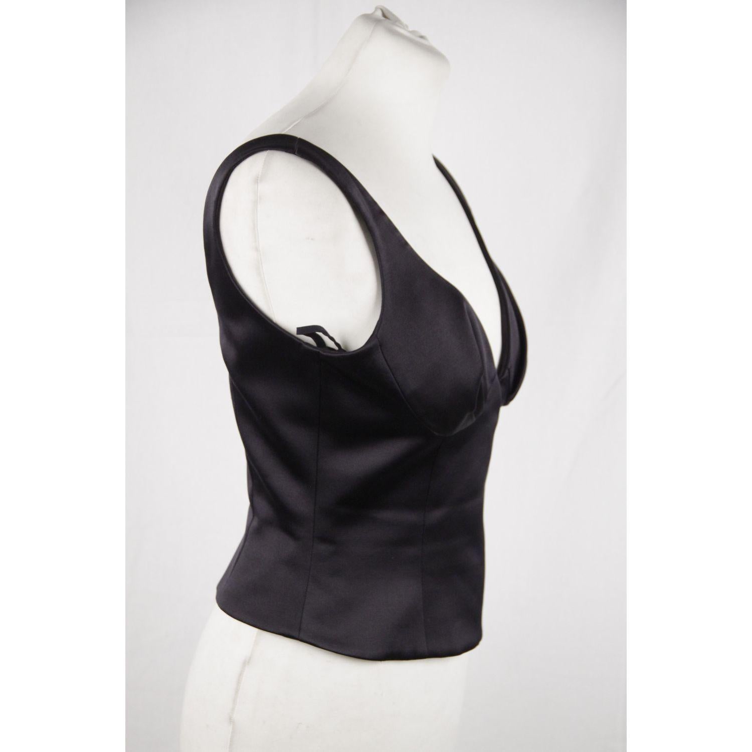 MATERIAL: Silk, Wool COLOR: Black MODEL: Tank Top GENDER: Women SIZE: Extra Small COUNTRY OF MANUFACTURE: Italy Condition CONDITION DETAILS: B :GOOD CONDITION - Some light wear of use - A couple of small white marks on the front due to storage