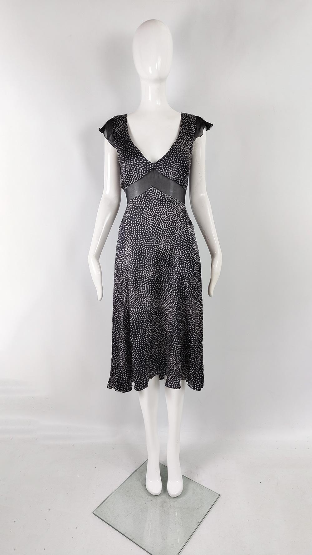 A fabulous vintage womens evening / party dress from the A/W 2004 collection by luxury Italian fashion house, Emporio Armani, designed by Giorgio Armani. As seen on the runway, this stunning dress is in a pure, bias cut silk satin with a polka dot