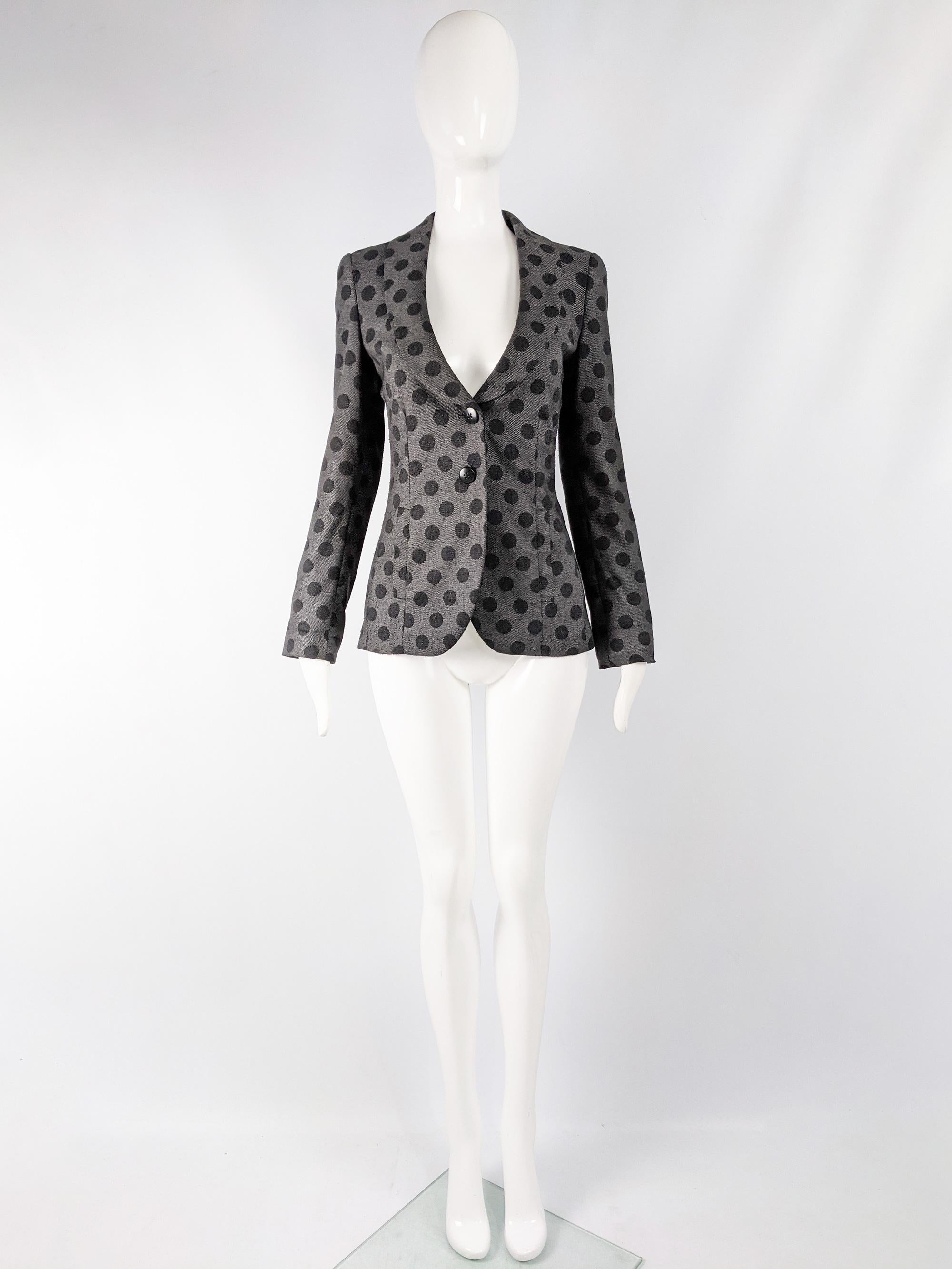 A chic preowned womens Emporio Armani blazer jacket with a large polka dot pattern woven throughout. 

Size: Marked IT 38 but fits more like a UK 8/ US 4/ EU 36. Please check measurements. 
Bust - 34” / 86cm
Waist - 28” / 71cm
Length (Shoulder to