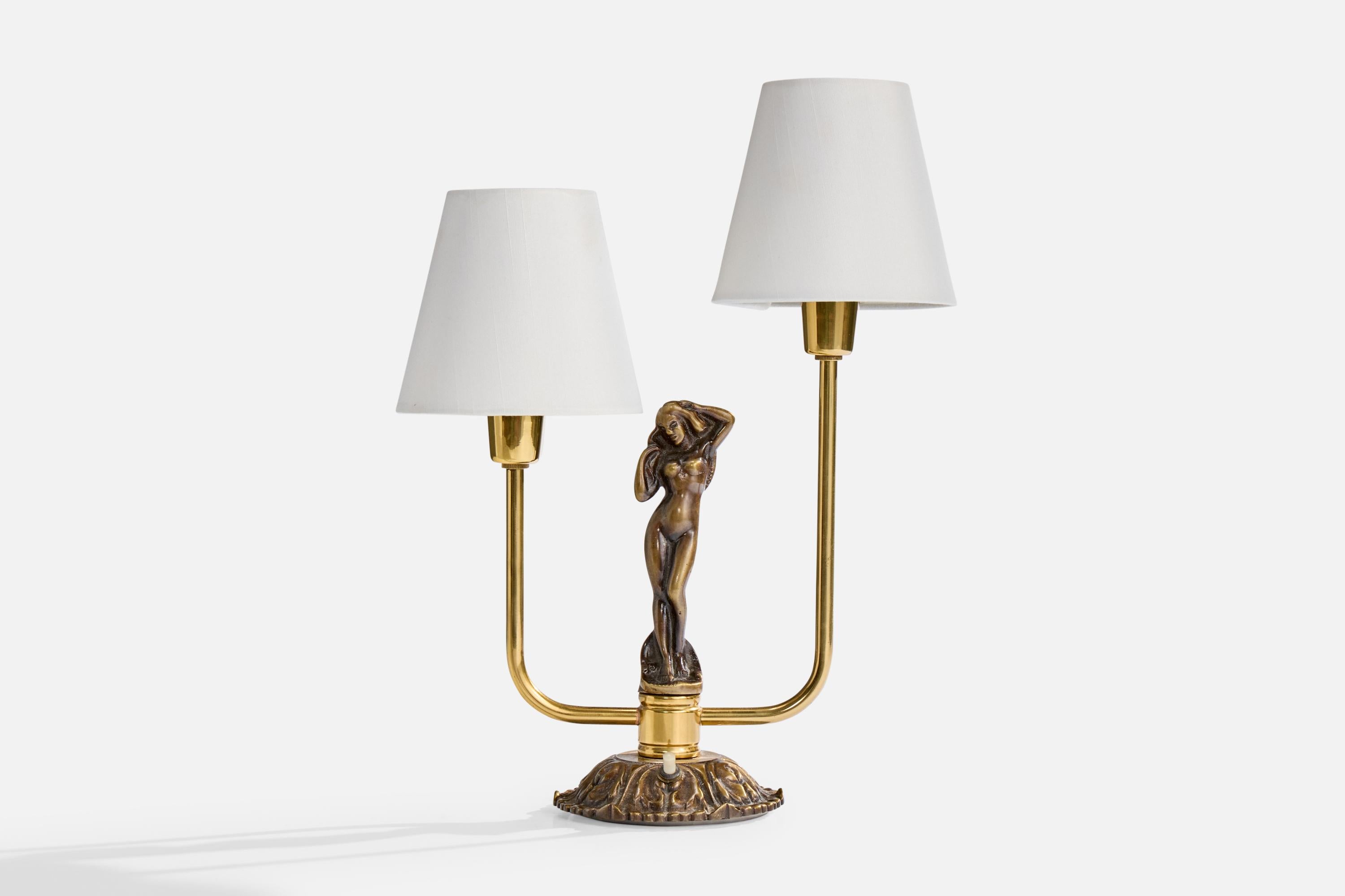 A brass and white fabric table lamp produced by Armaturbolaget, Sweden, c. 1940s.

Dimensions of Lamp with Shade (inches): 14.5