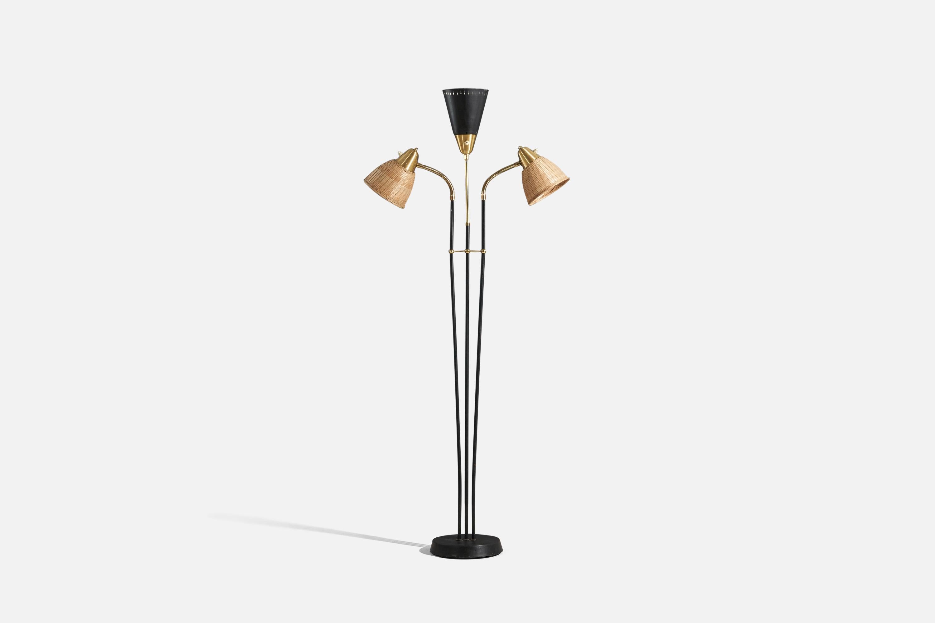 A brass, rattan and black-lacquered metal floor lamp designed and produced by Armaturhantverk Göteborg, Sweden, 1950s.

Sold with Lampshade(s). Dimensions stated are of Floor Lamp with Shade(s). 

Variable dimensions, measured as illustrated in the