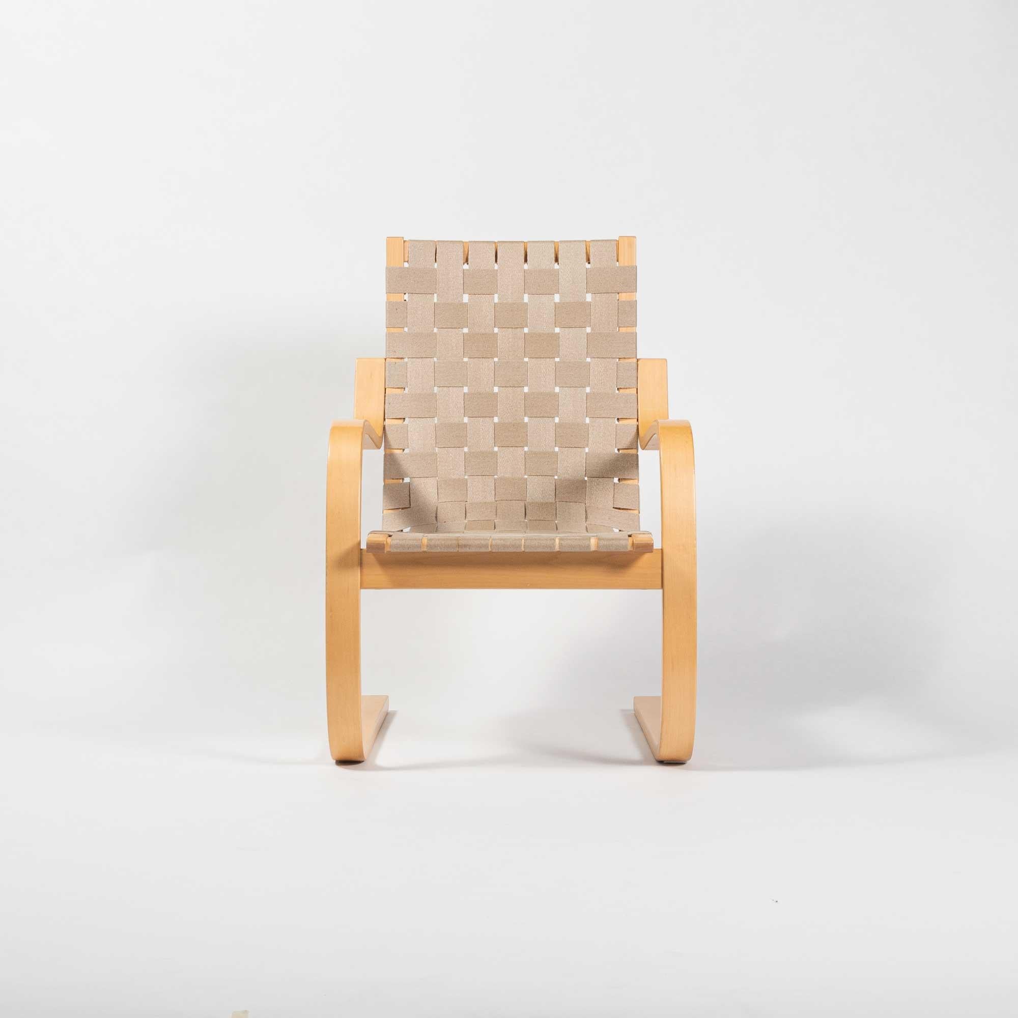2005 production Armchair 406 by Alvar Aalto for Artek in birch and natural webbing. This was affectionately nicknamed 