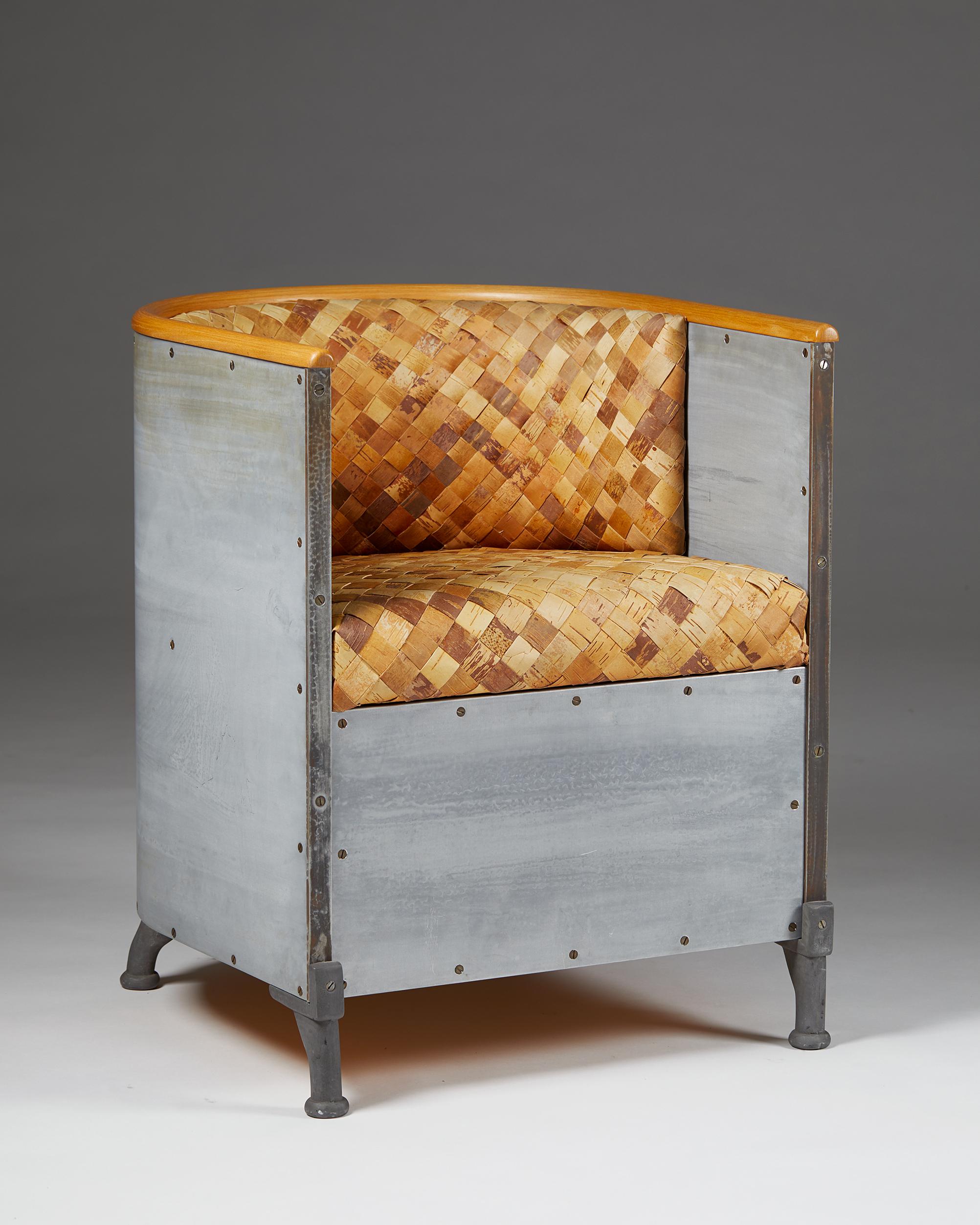 Armchair ‘Aluminiumfåtölj’ model 34-50/200 designed by Mats Theselius for Källemo,
Sweden, 1990.

Aluminium and birch bark.

50 examples of this chair model were made in birch bark, and the rest in leather.

This example is marked one of the fifty