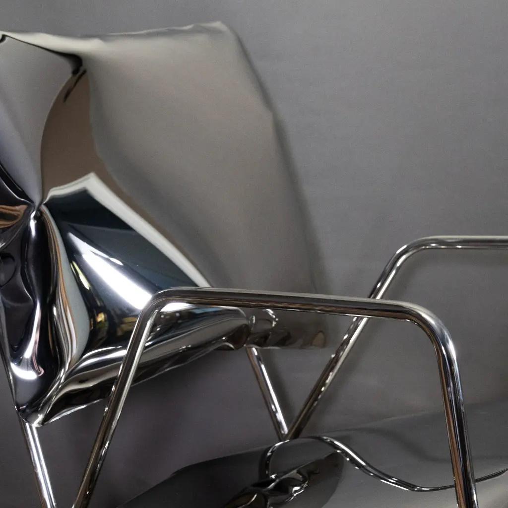 Moderne Fauteuil et repose-pieds, Design/One des années 70, Acier inoxydable, Pièce unique en vente