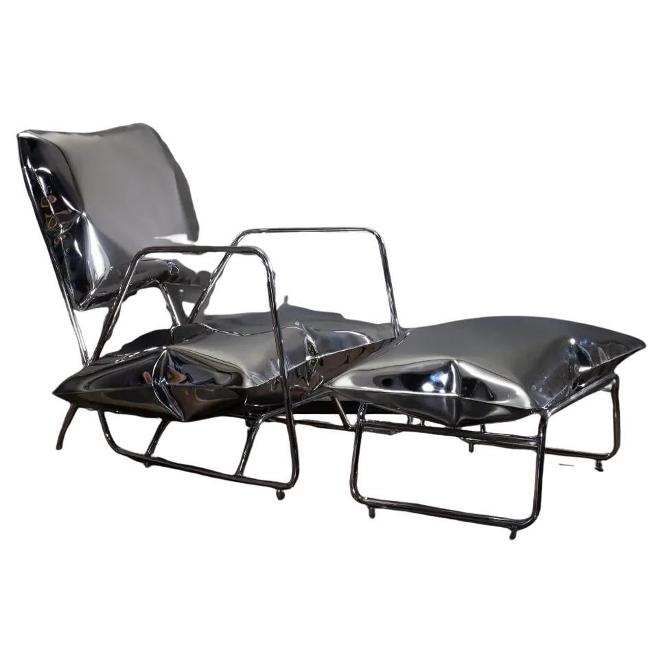 Fauteuil et repose-pieds, Design/One des années 70, Acier inoxydable, Pièce unique en vente