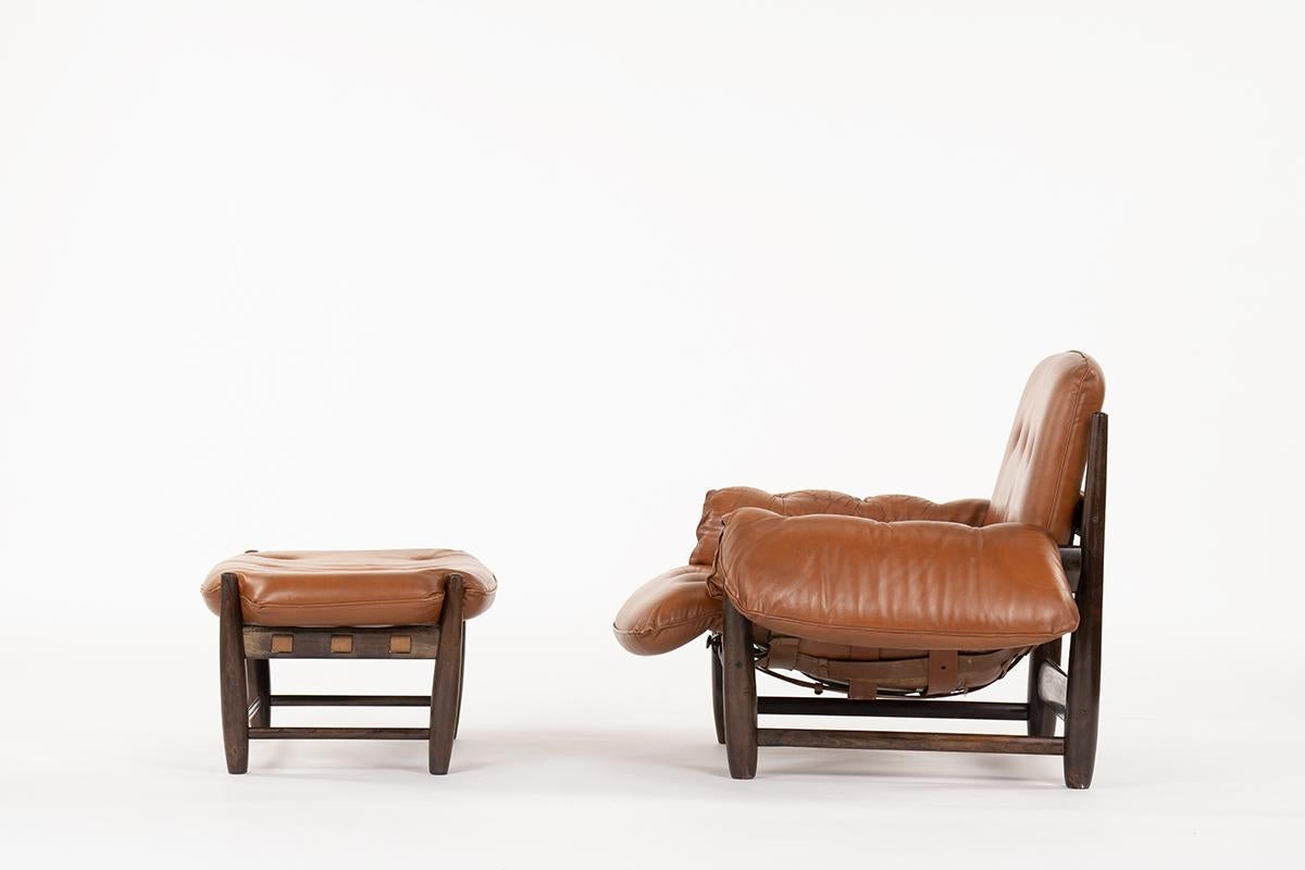 Armchair and footrest by the famous Sergio Rodrigues Brazilian designer. Model design in 1957 fantastic and minimalist shapes for a perfect comfort. Currently on display in the permanent collection of Moma in New York. 
Coming from a Parisian