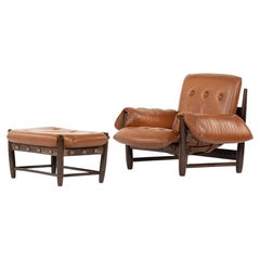 Armchair and Footrest Lounge Chair by Sergio Rodrigues in Brown Leather, 1957