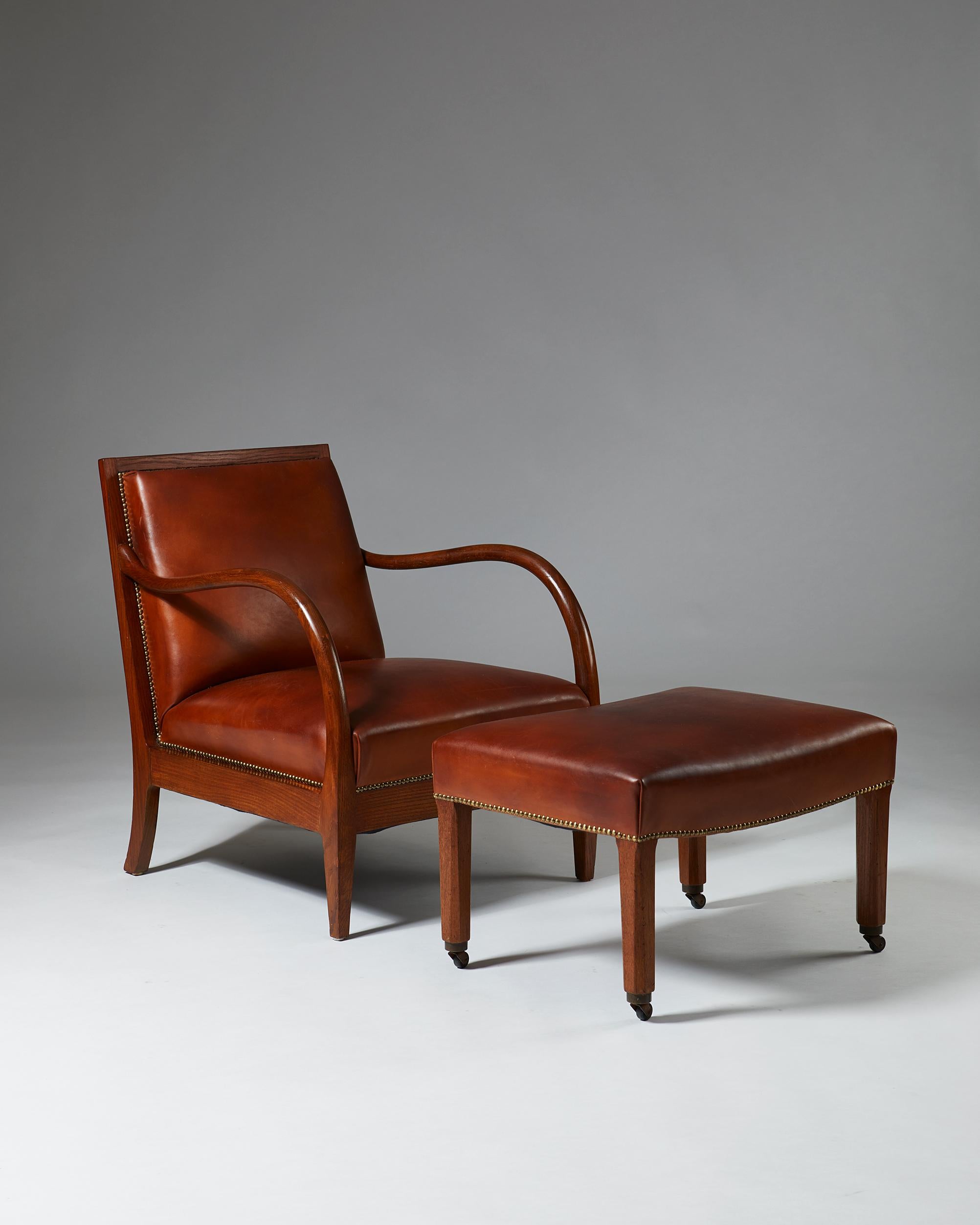 Oak, brass and leather.

Measures: Armchair
H 79.4 cm/ 31 1/2