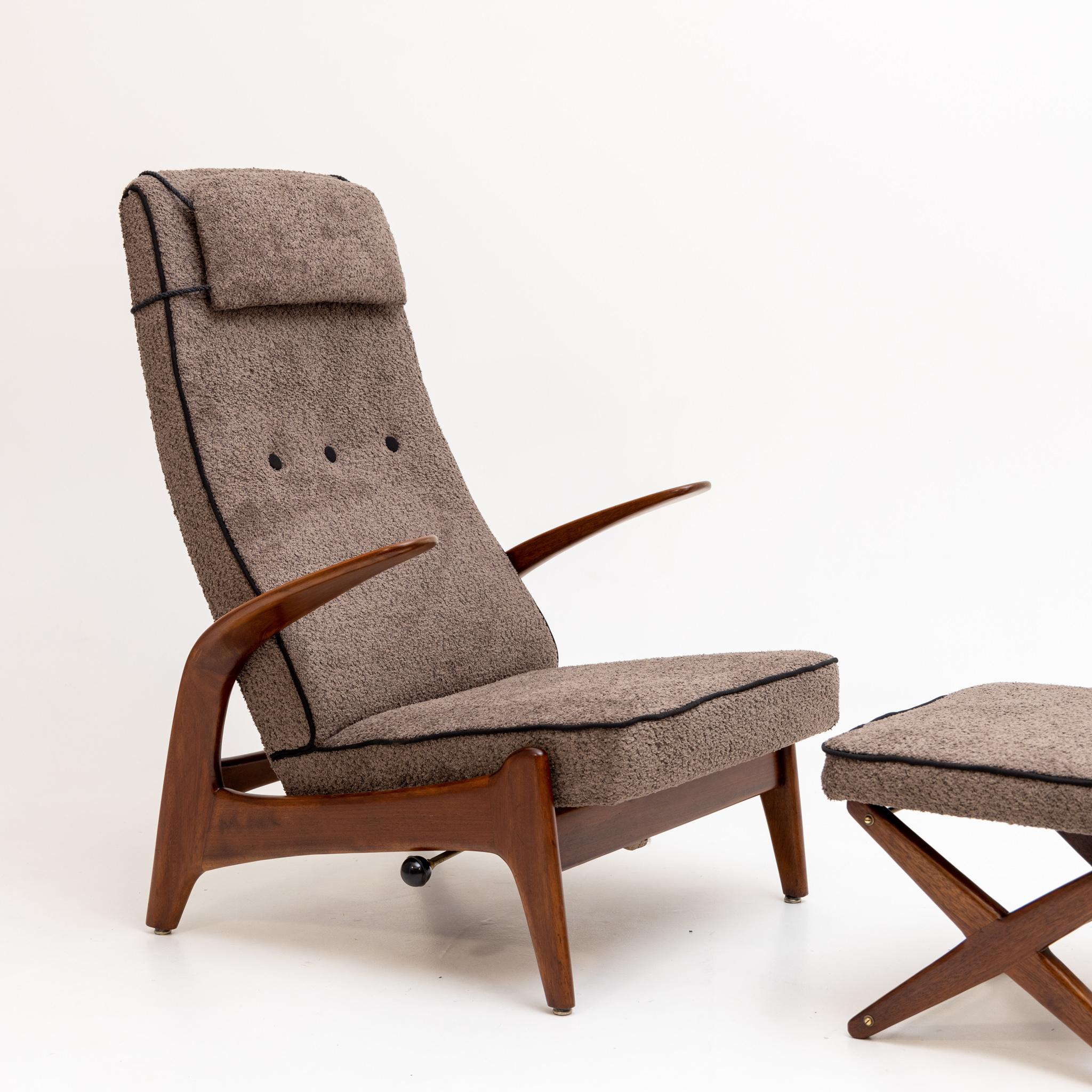 Armchair with footstool by Rolf Rastad & Adolf Relling for Arnestad Bruk, Norway 1950s.The seat is newly upholstered in a brown bouclé fabric and can be adjusted in inclination.