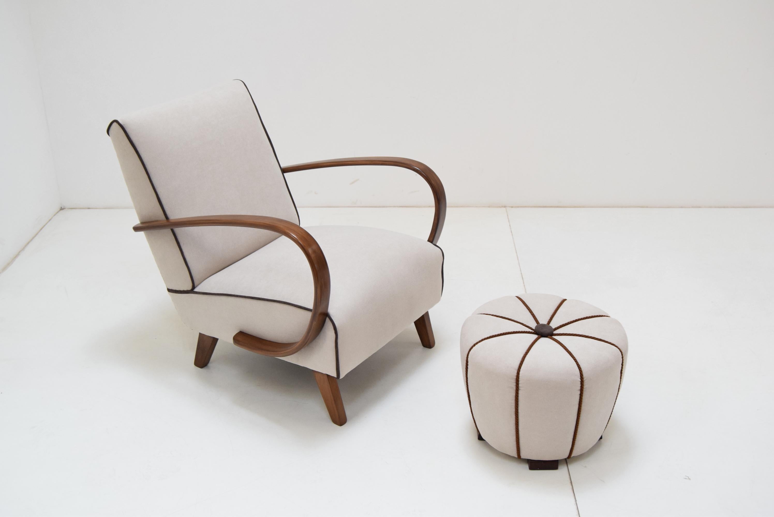 Armchair and Tabouret by Jindrich Halabala, 1950's.
Made in Czechoslovakia
New upholstery and restored wood, completely restored
Measures: Tabouret: Height 34cm
 Depth 43cm
 Width 43cm.