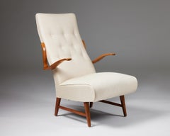 Sillón moderno sueco de los años 40 - Brazos escultóricos de madera y asiento tapizado