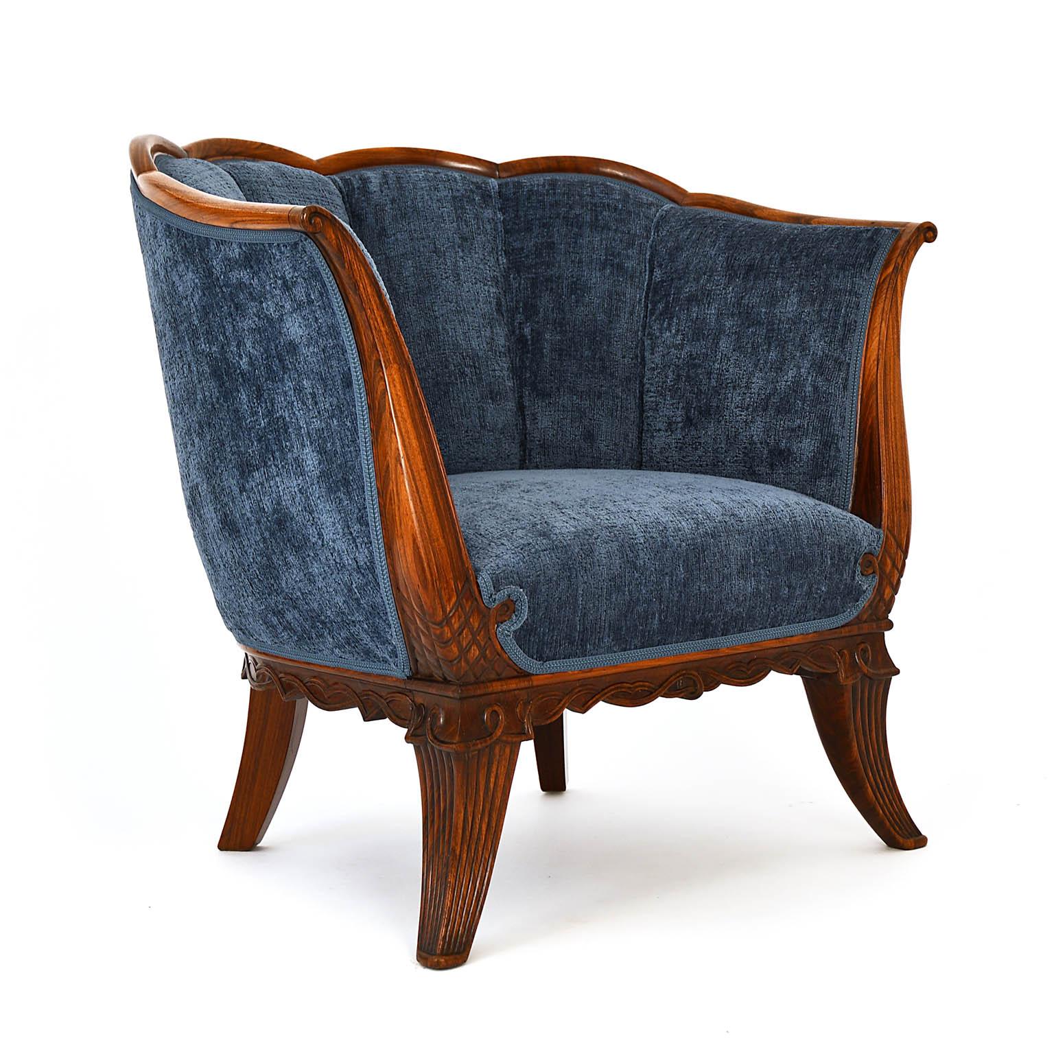 Armchair, Dagobert Peche style, from the Art Deco period with a lavishly carved frame in rosewood. The shell shape so clearly reflects the form of the time. The piece was found in Vienna and comes from one of the excellent workshops around the