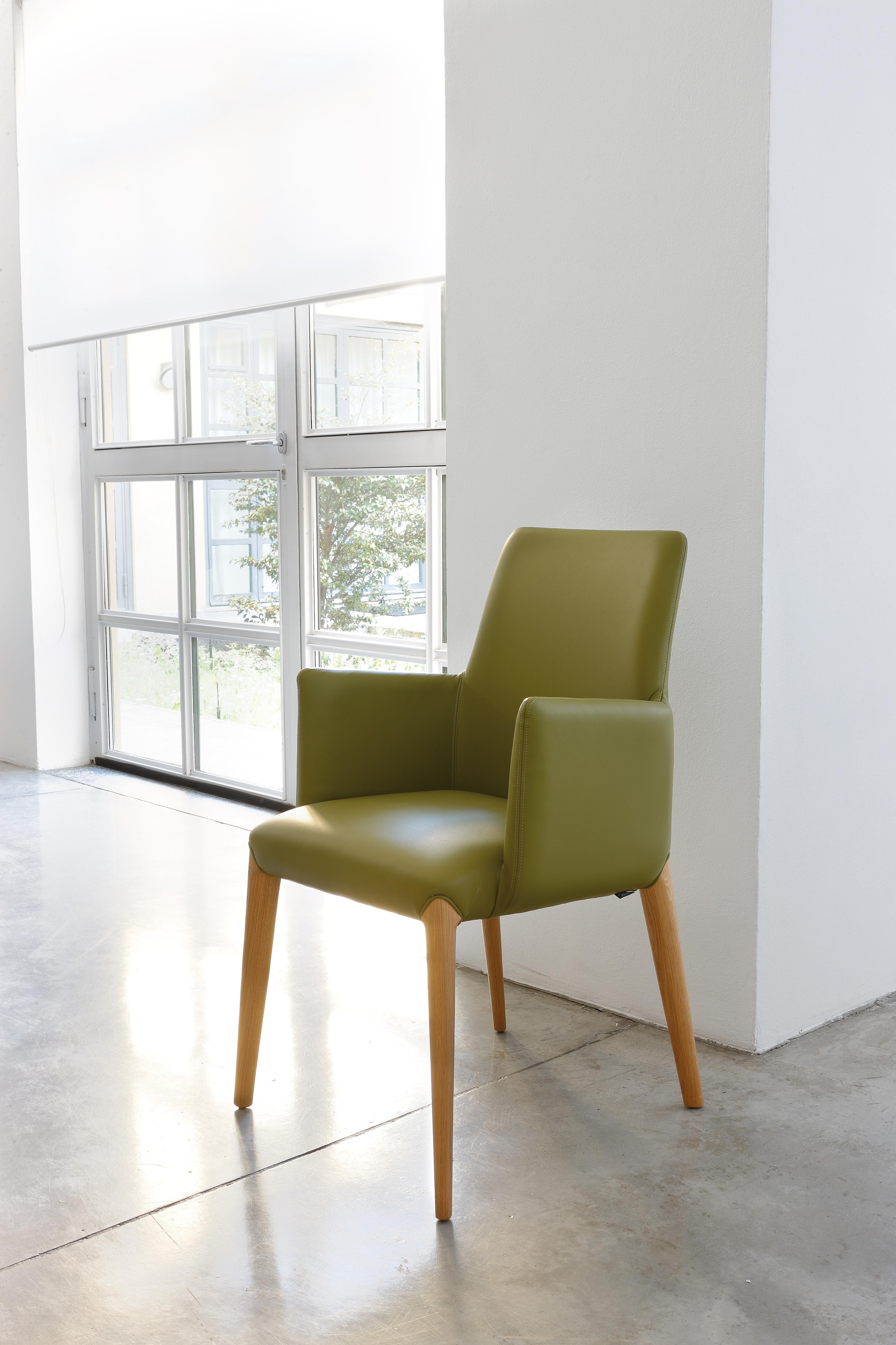 Contemporary armchair art. Ines in green leather for living room or restaurant, confortable  For Sale