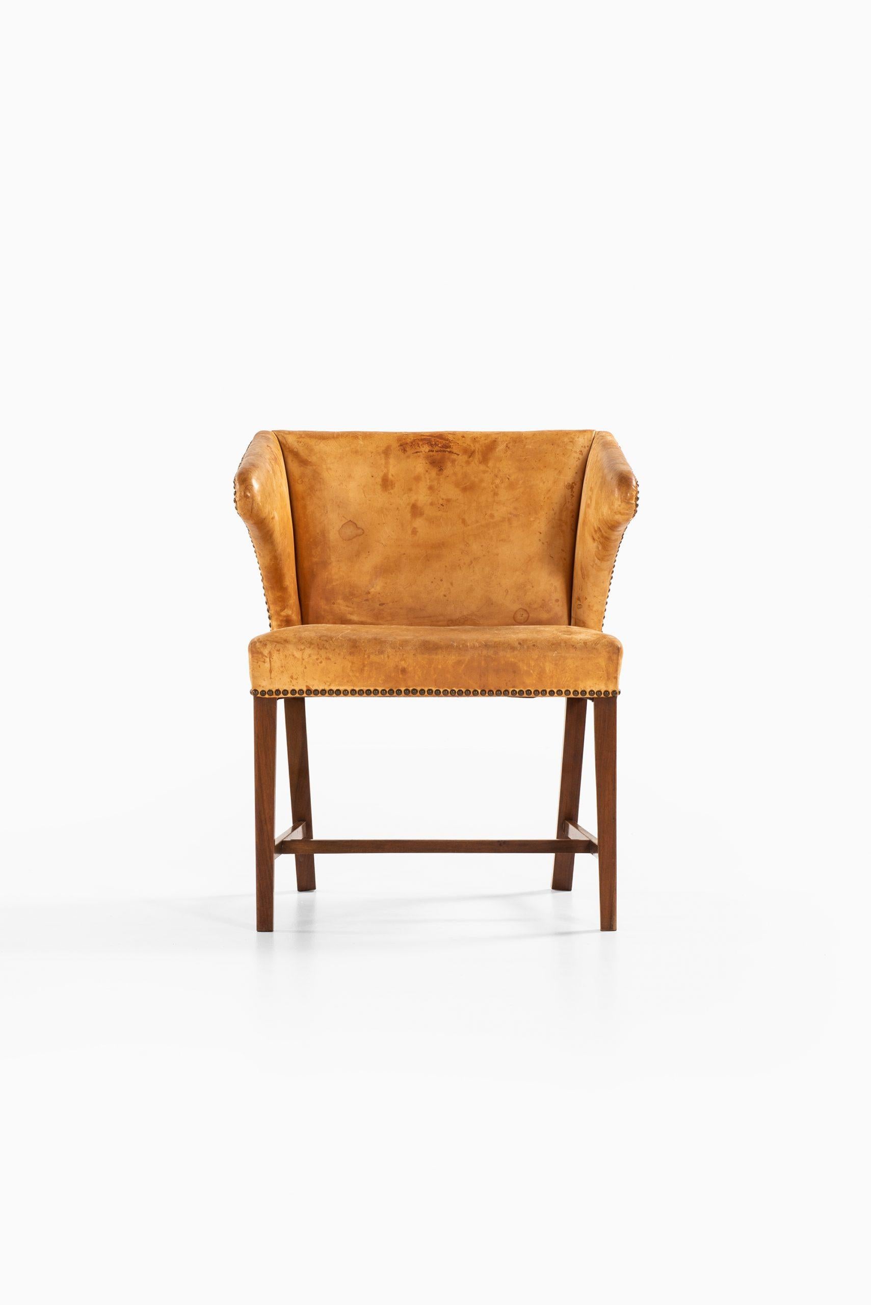 Very rare armchair attributed to Frits Henningsen. Produced by cabinetmaker Frits Henningsen in Denmark.
