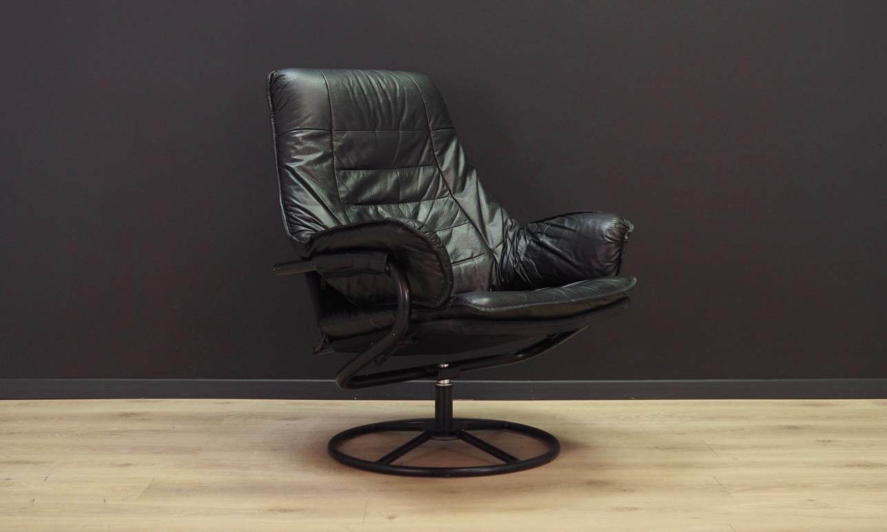 Fantastic armchair from the 1960s-1970s. Scandinavian design, Minimalist form. Original upholstery made of black leather. Rotary construction made of metal. Maintained in good condition (minor bruises and scratches), directly for use.

Dimensions: