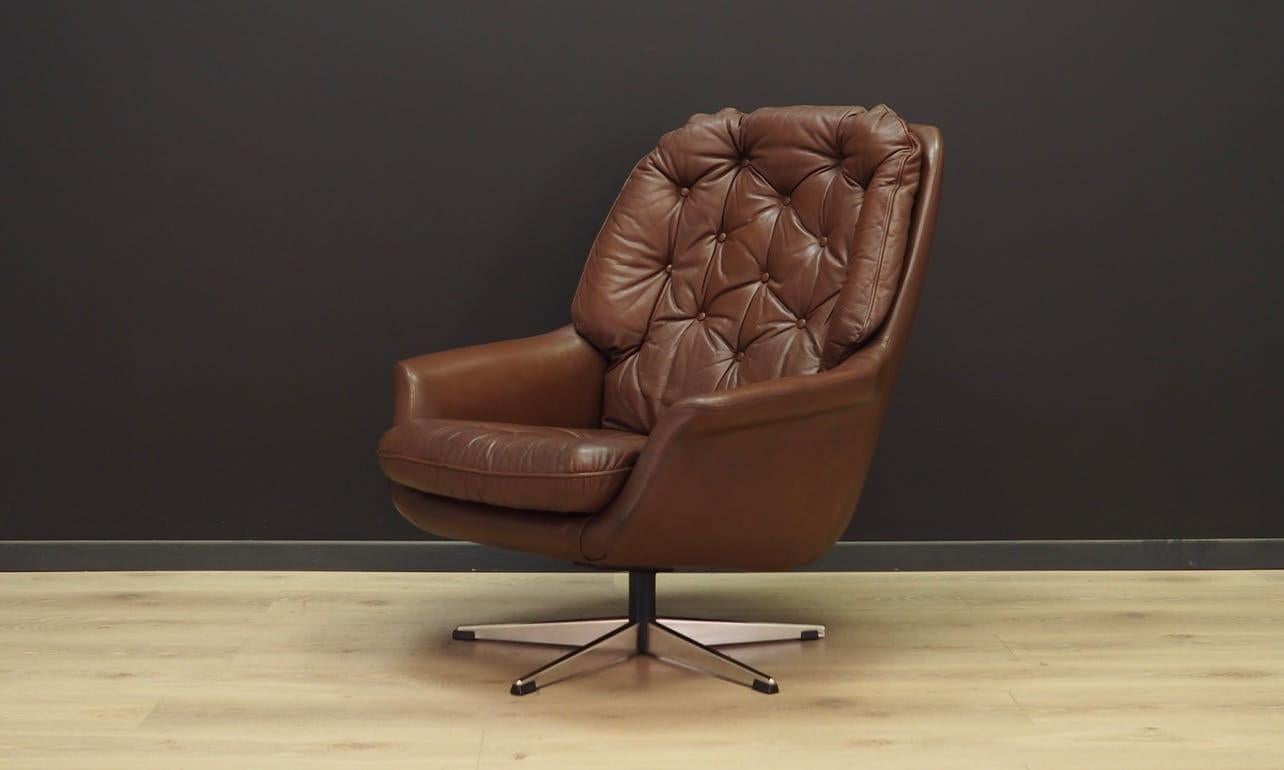 Exceptional armchair from the 1960s-1970s, beautiful Minimalist form, Scandinavian design. Armchair covered with original leather in brown, steel construction. Maintained in good condition (minor abrasions and bruises on the leather), directly for